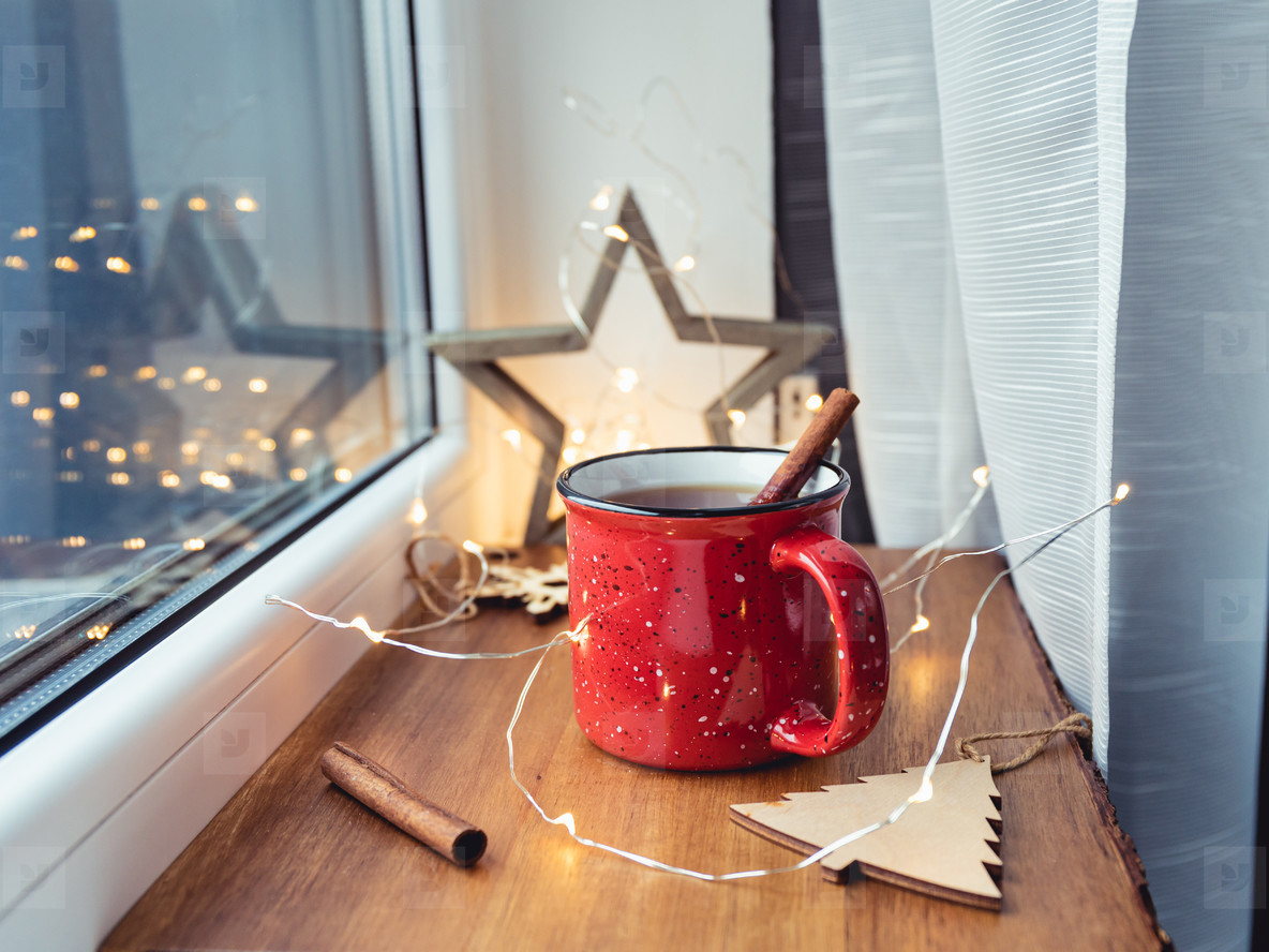 Black tea with cinnamon in a red mug