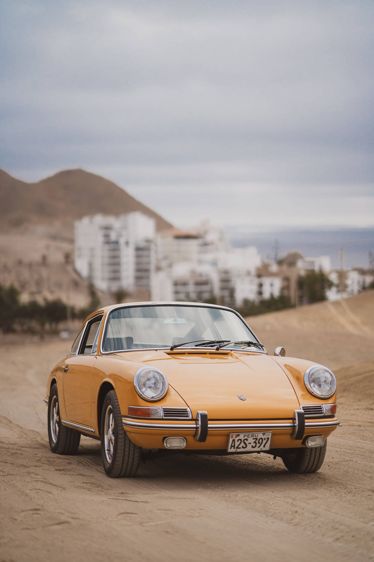 Download free Vintage Porsche 912 Driving At A Desert Wallpaper