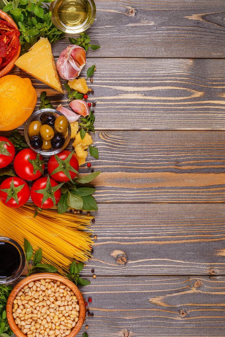 Italian food background on wooden table, copy space, top view