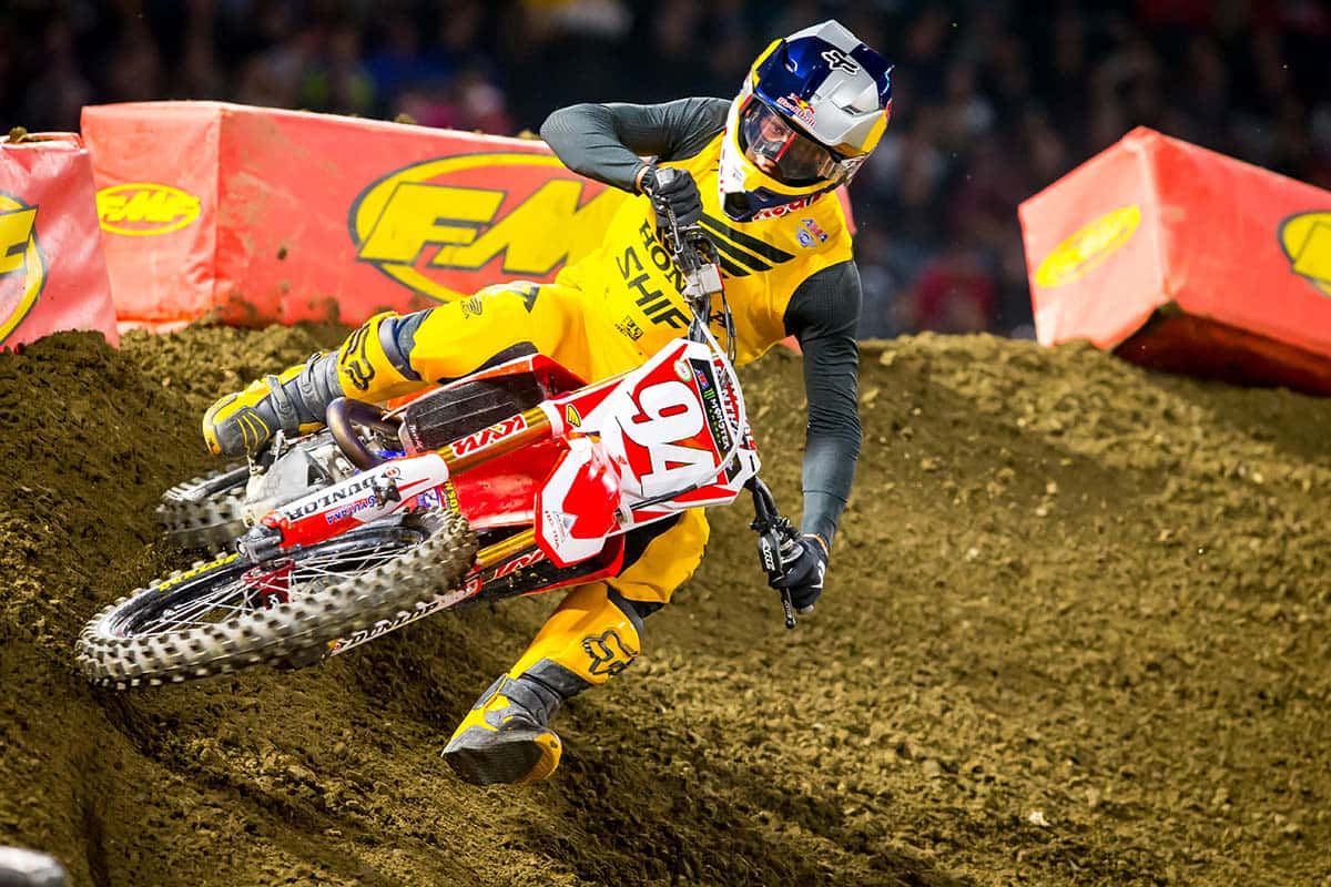 Download Motocross champion Ken Roczen competing in a race Wallpaper