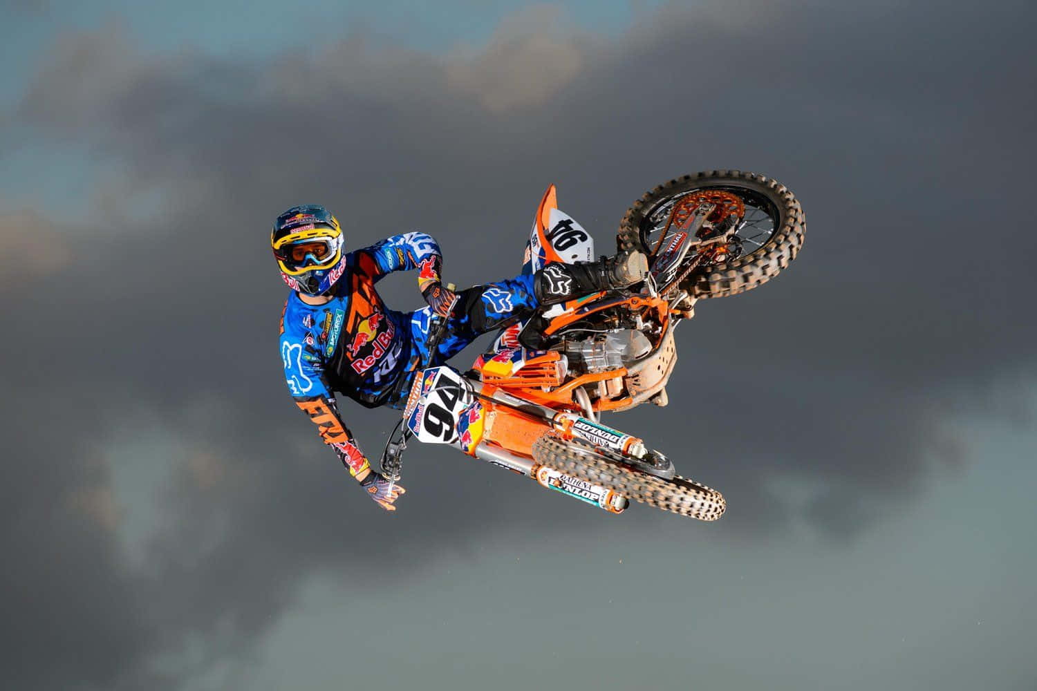 Download A Dirt Bike Rider In The Air Wallpaper