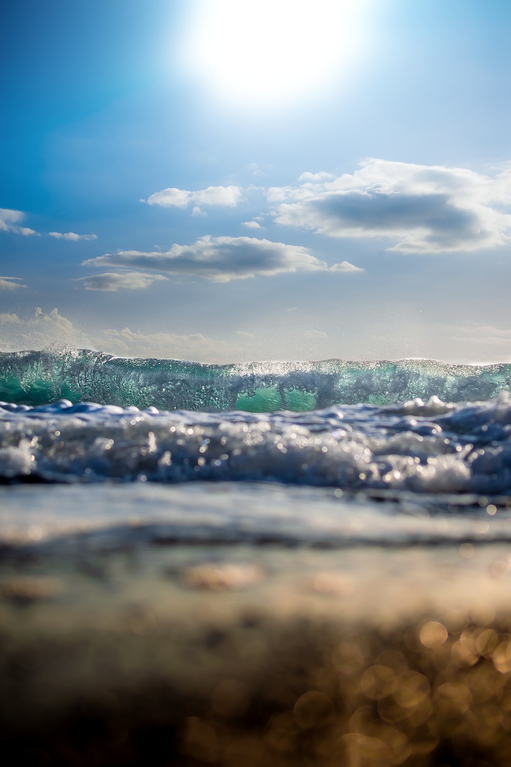 Sea waves under clear blue sky photo