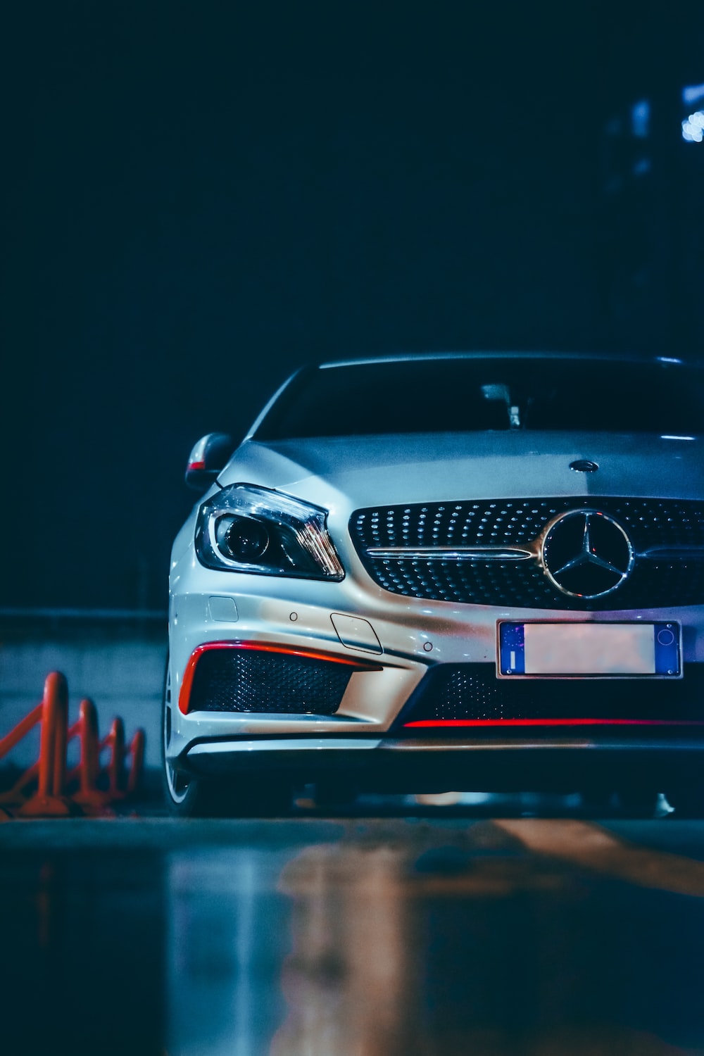 Black mercedes benz car in a dark room