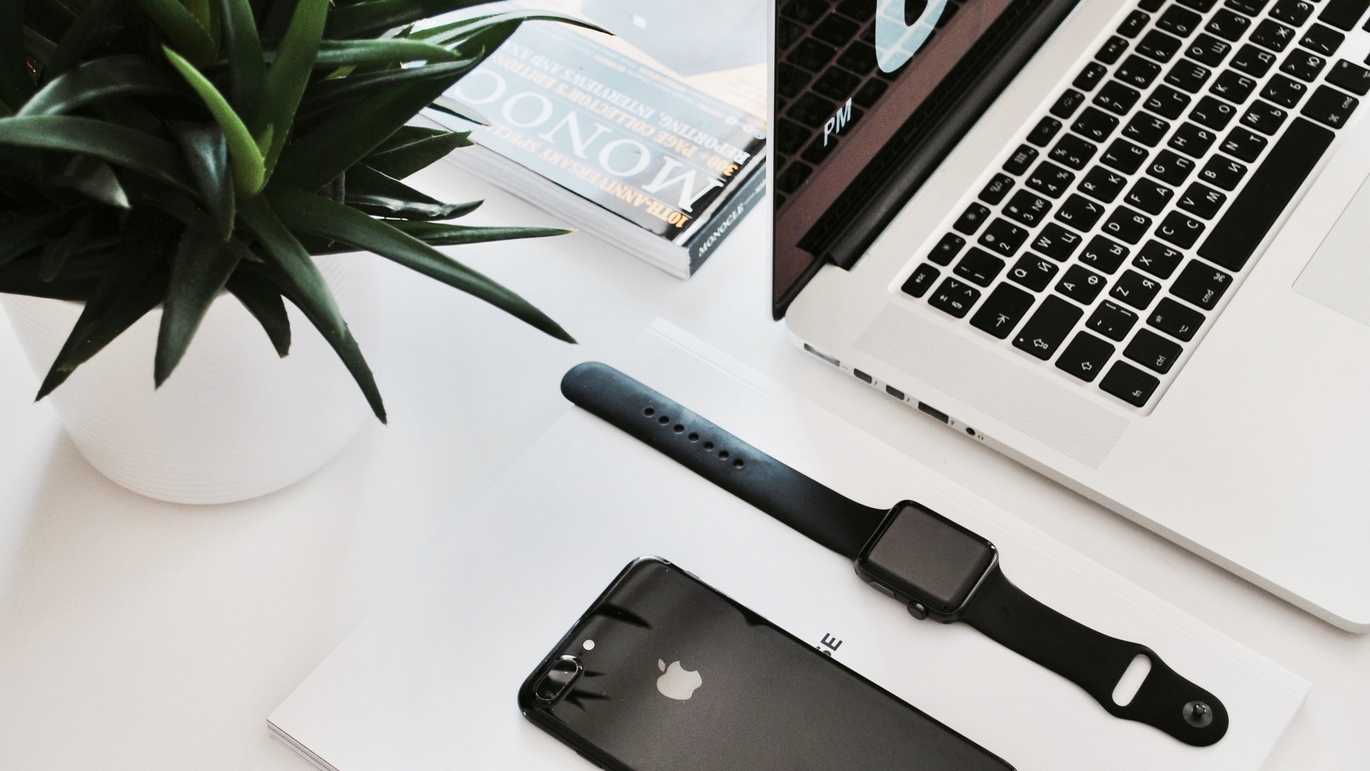 an apple watch and an iphone on a desk