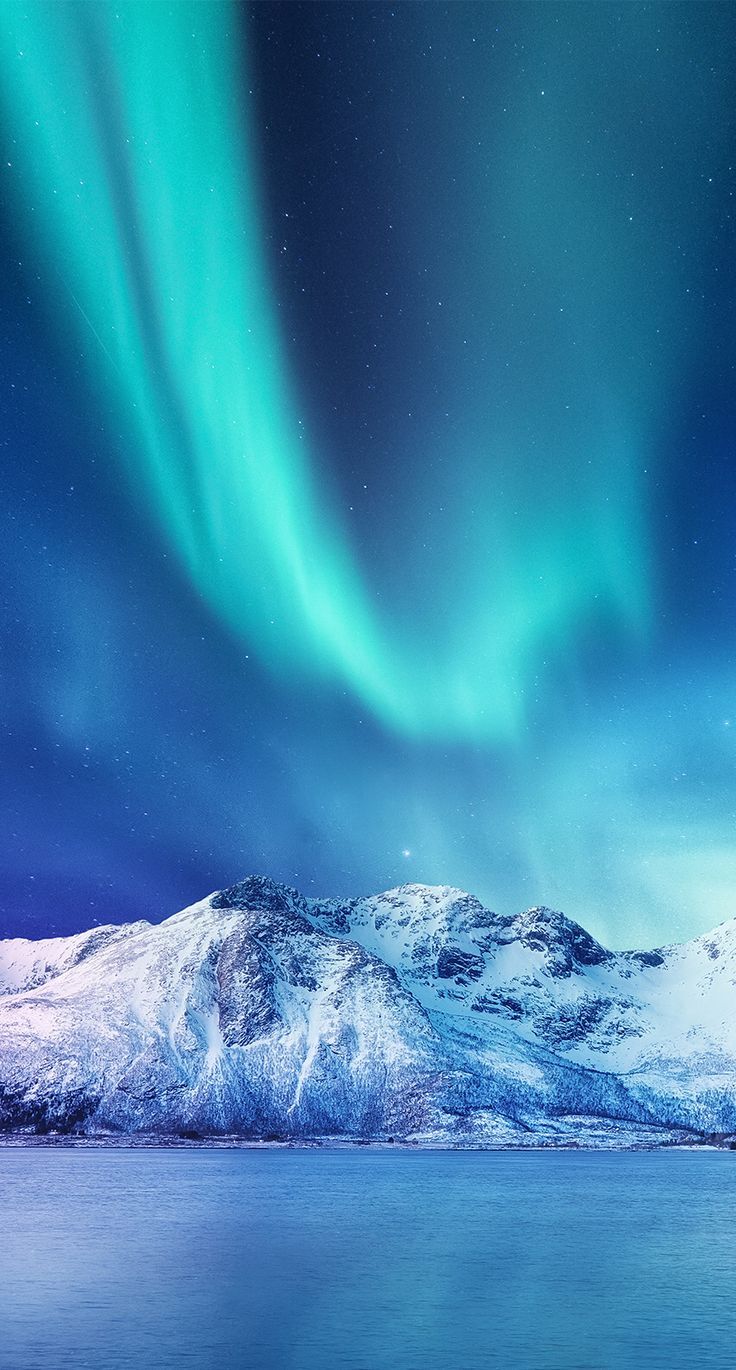 Aurora Borealis Over Snowy Mountains