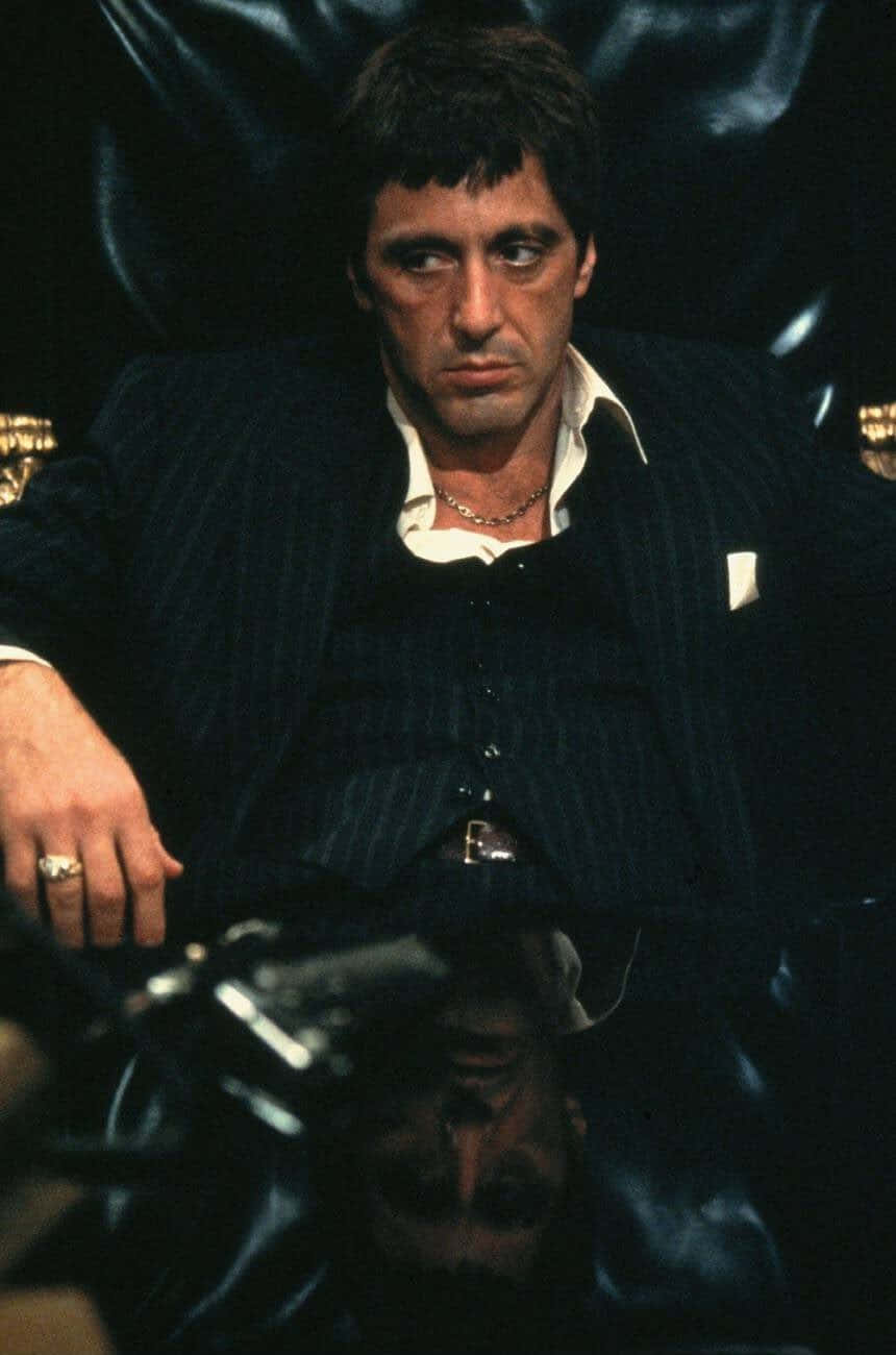 Suit Sitting In A Chair Wallpaper