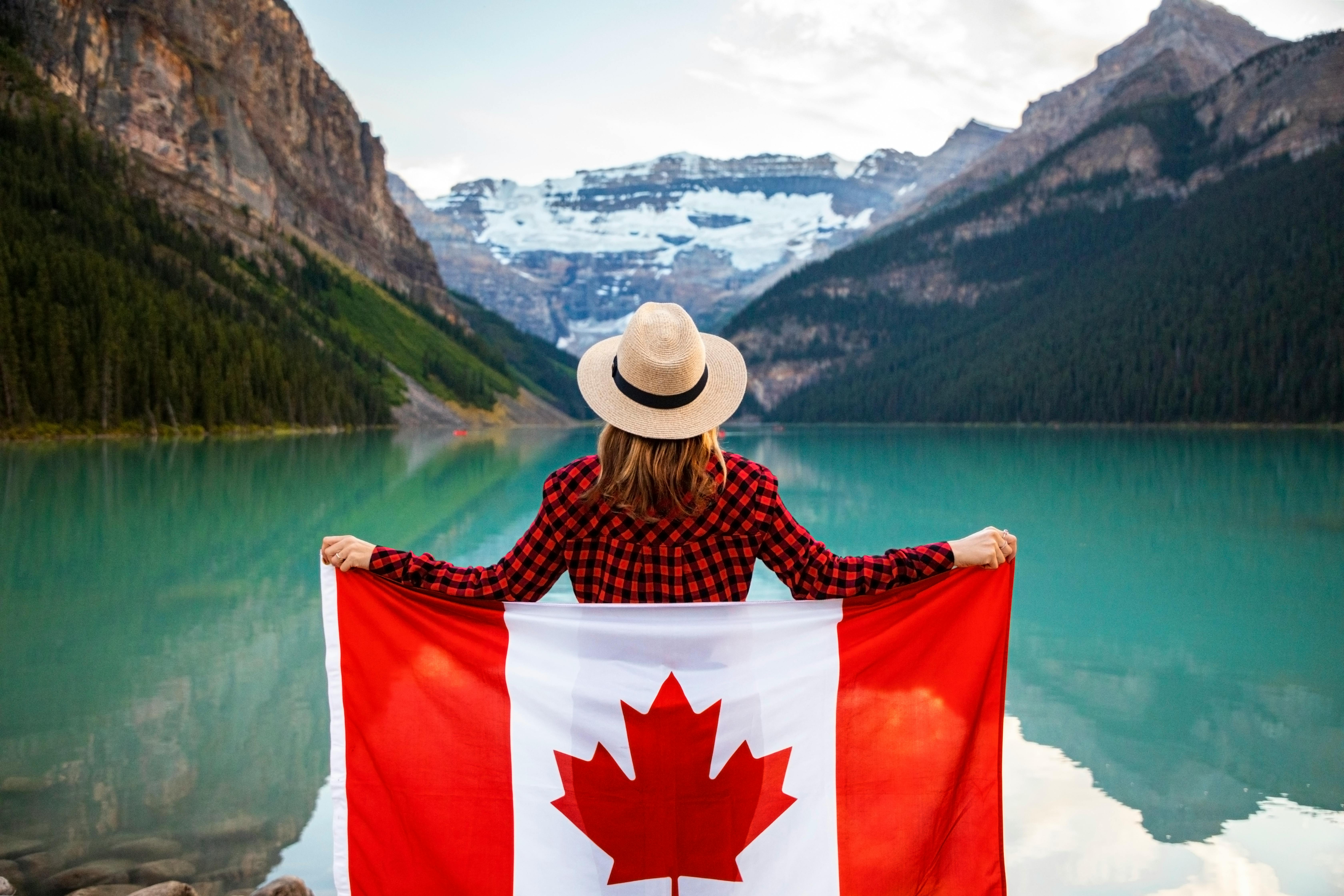 Beige Fedora Hat Holding Canada Flag