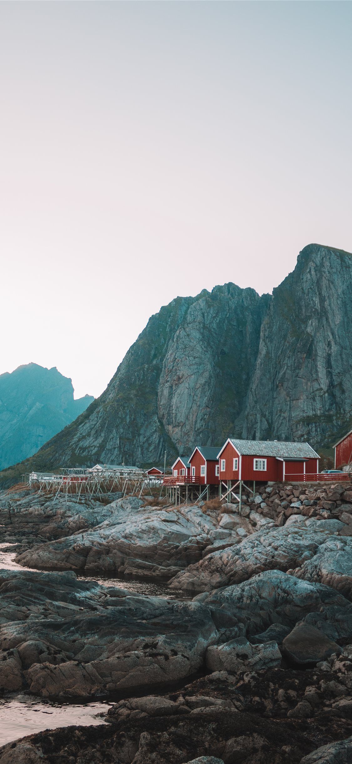 houses beside rock mountain #mountain
