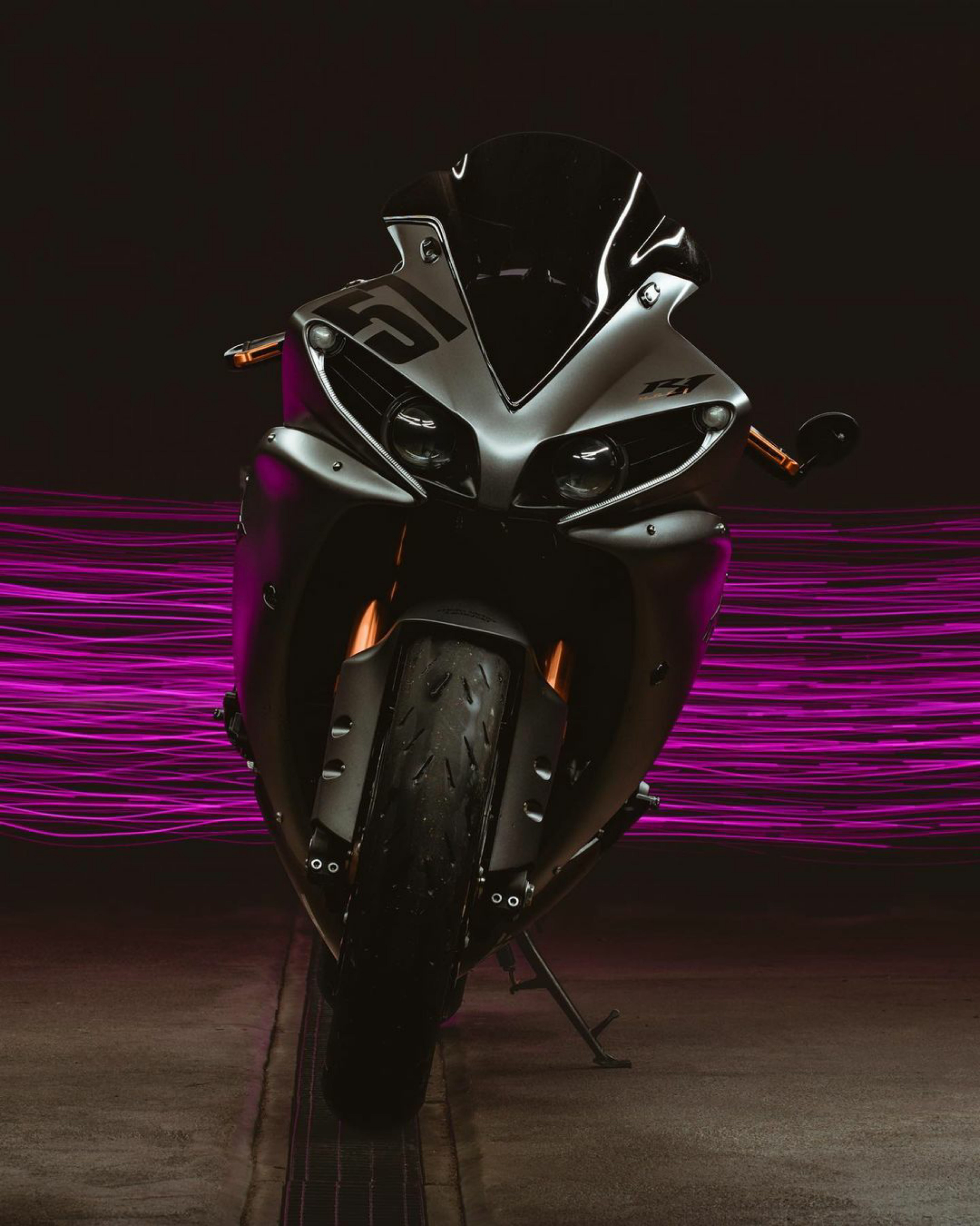 A Black Sports Bike Parked on the Road