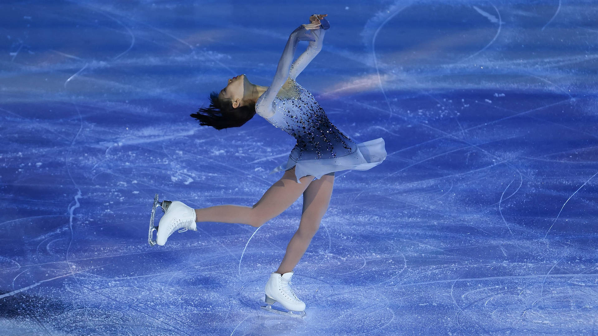 Download Thrilling Moments from an Ice Skating Competition Wallpaper