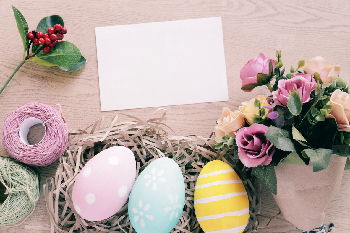 Pastel and colorful easter eggs in nest