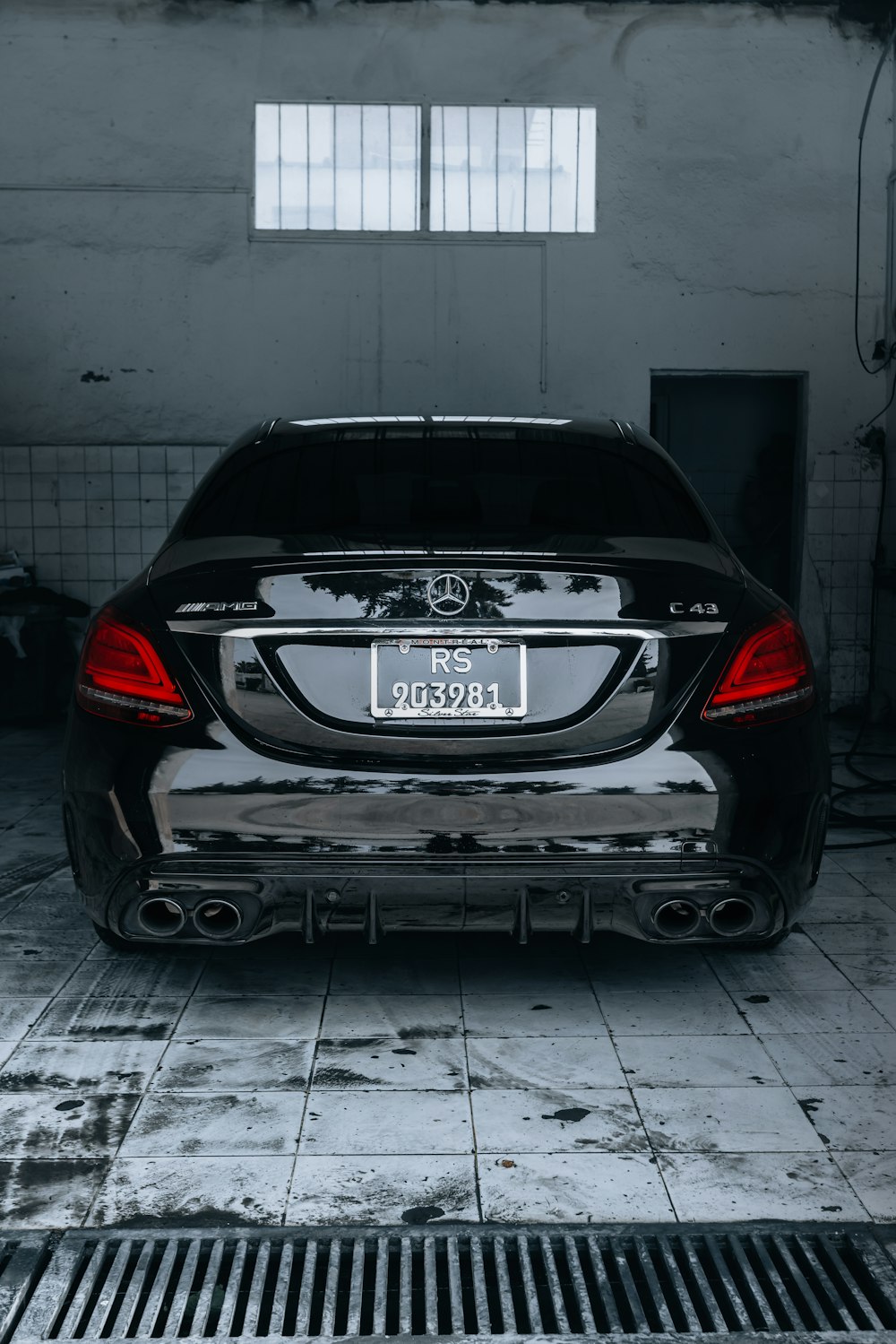 A black car parked in a garage next to