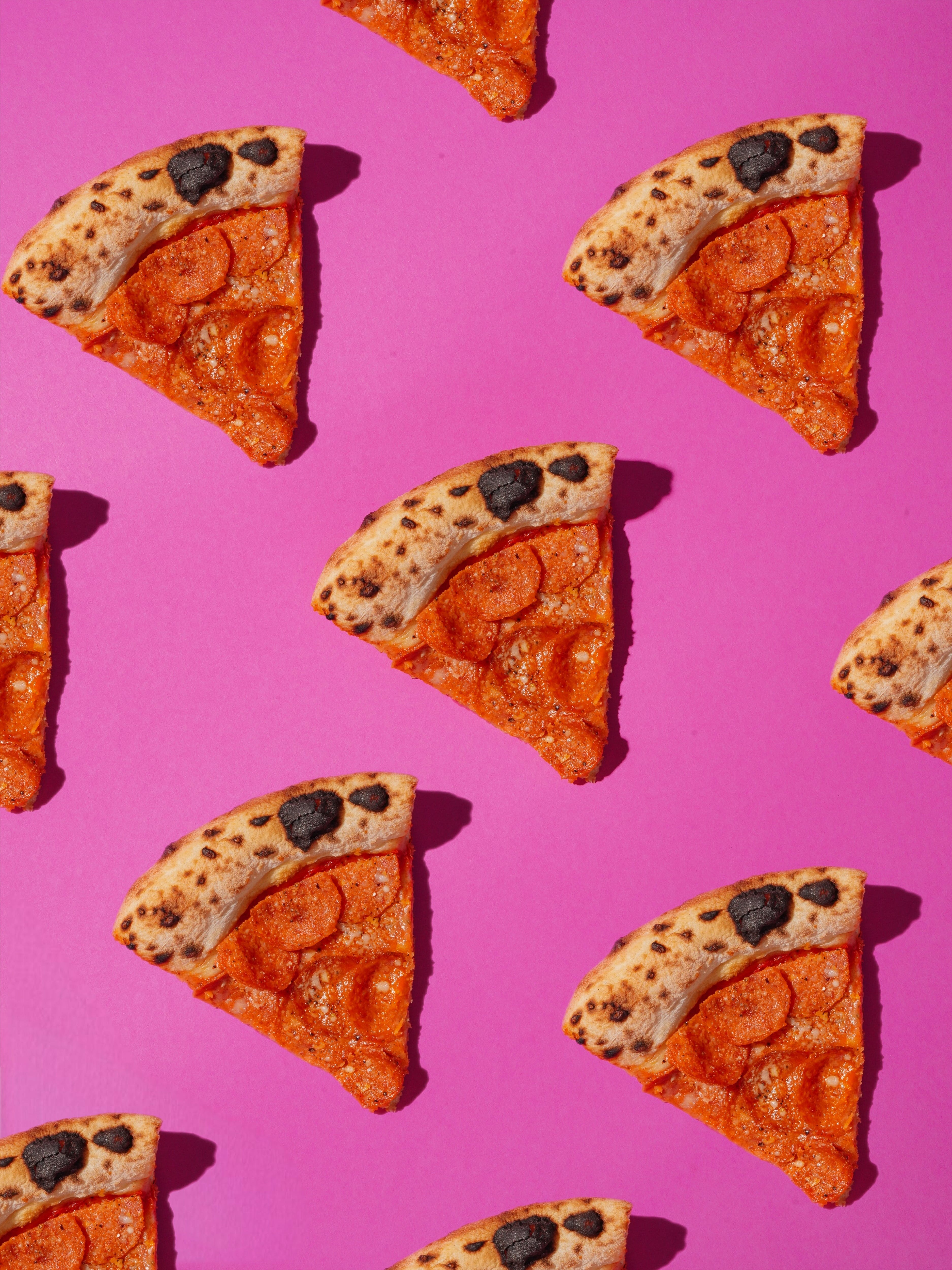 Pizza Slices on Pink Background · Free