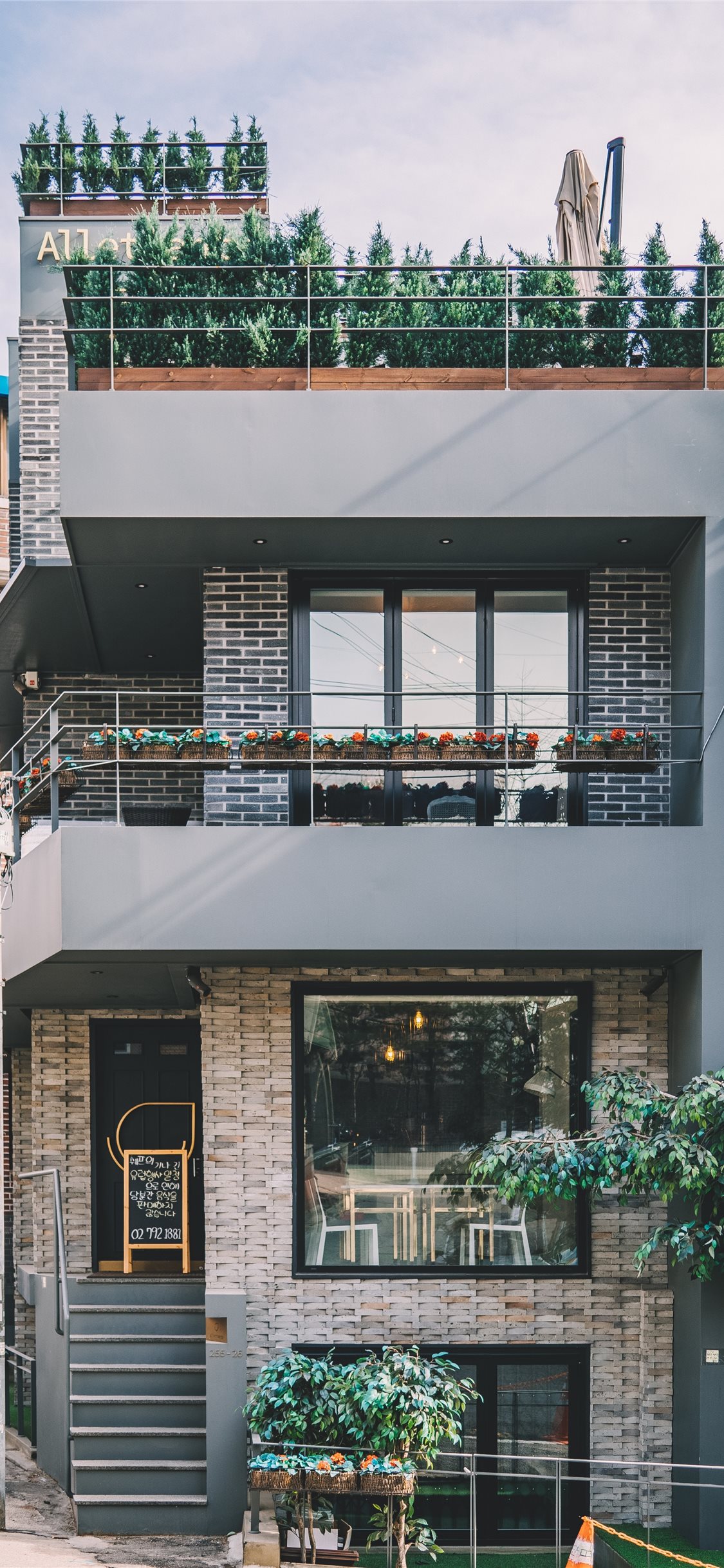 gray and brown 2 storey house iPhone X