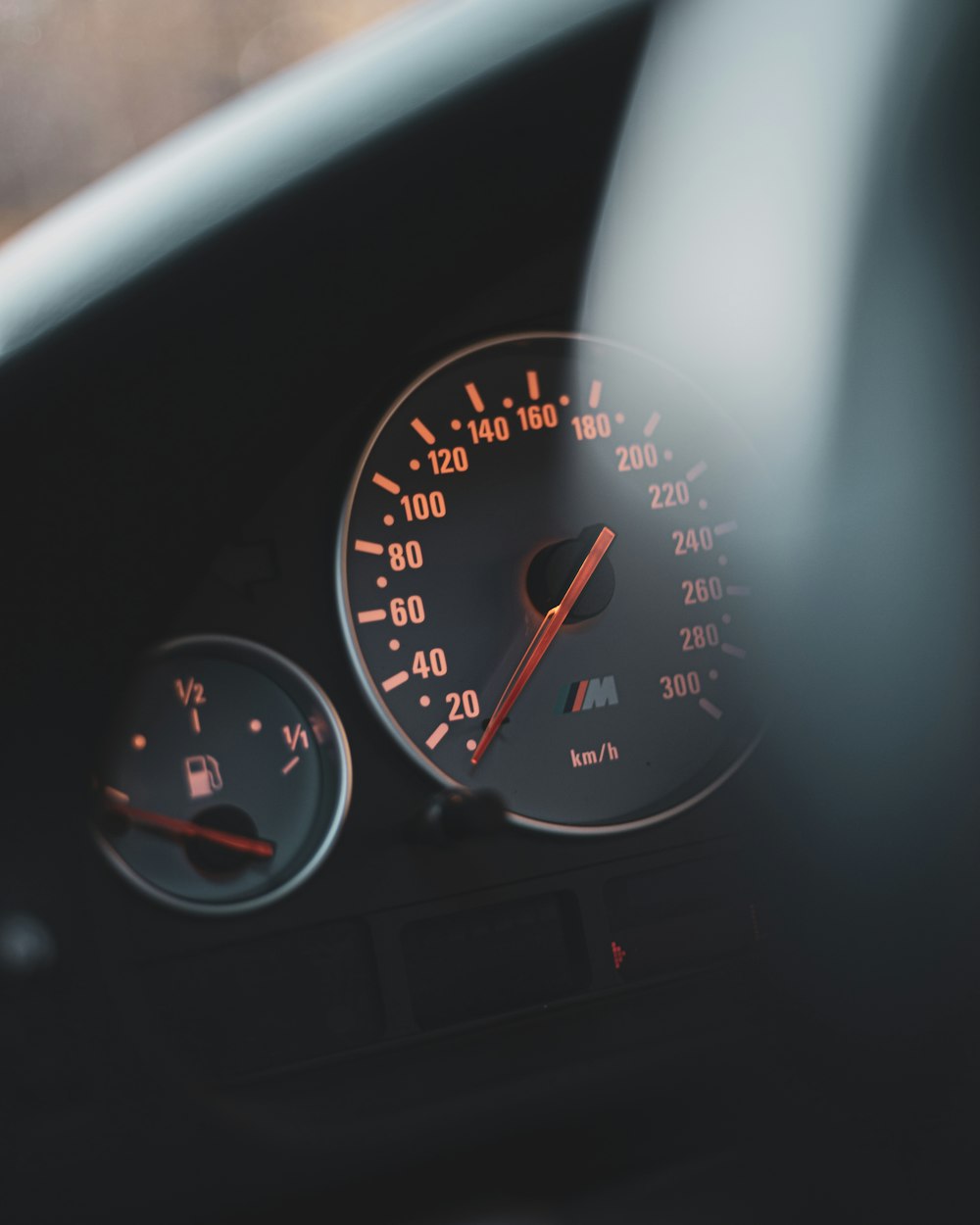 A close up of a speedometer on a car