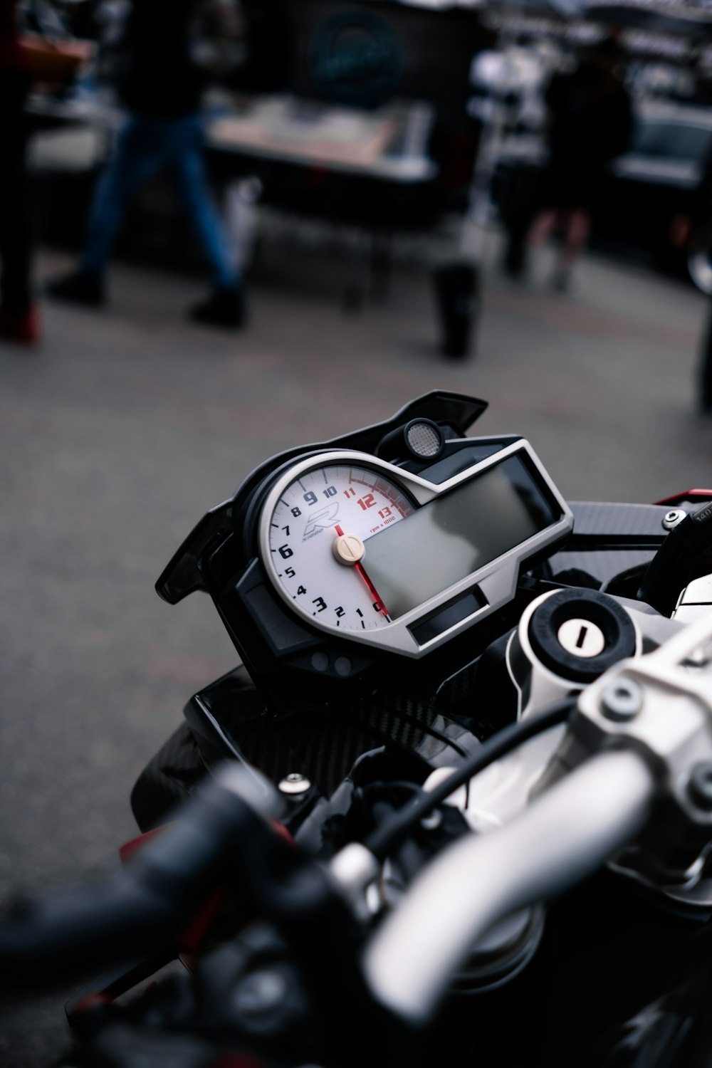 Black and silver motorcycle speedometer