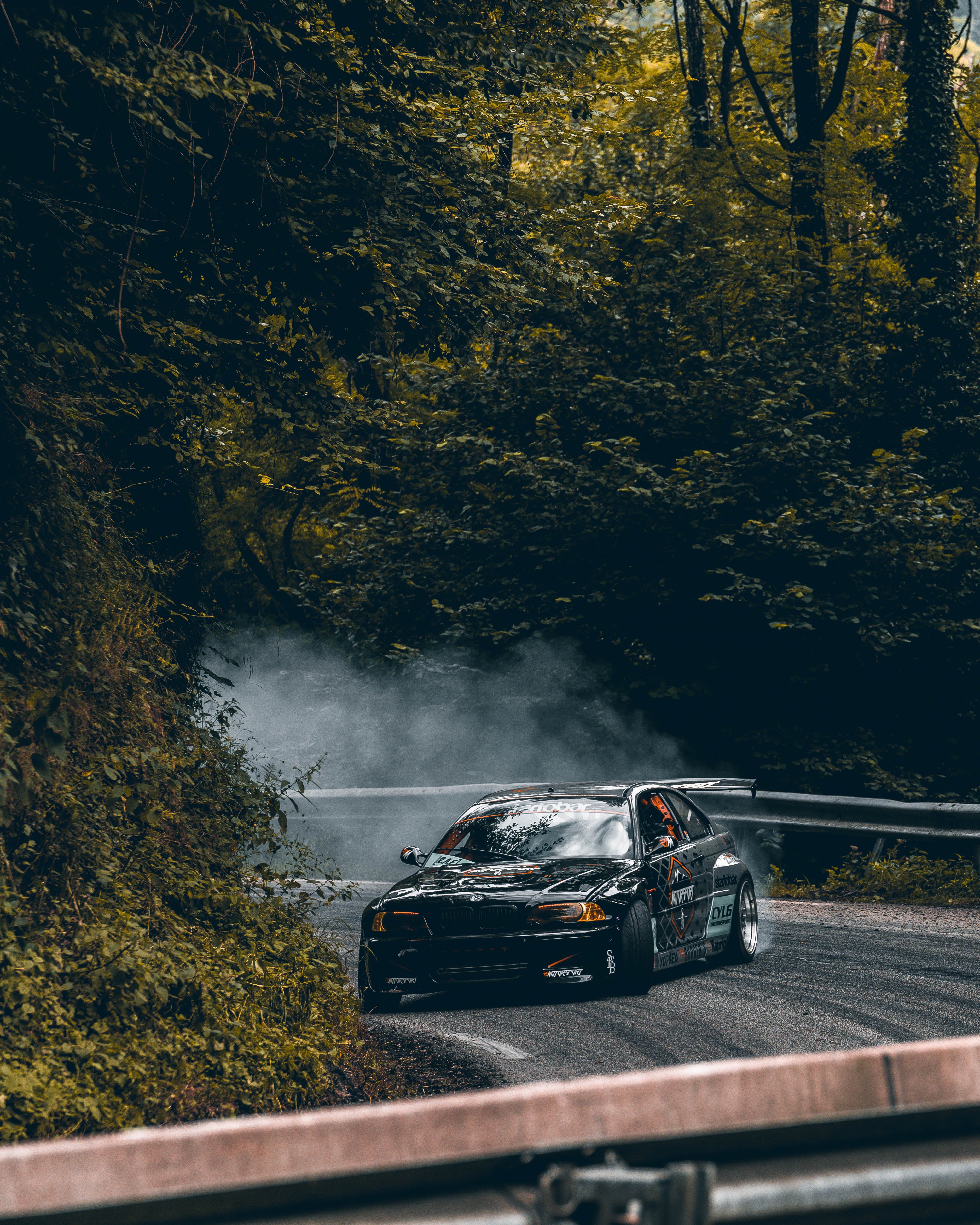 Race Car Drifting on Road through