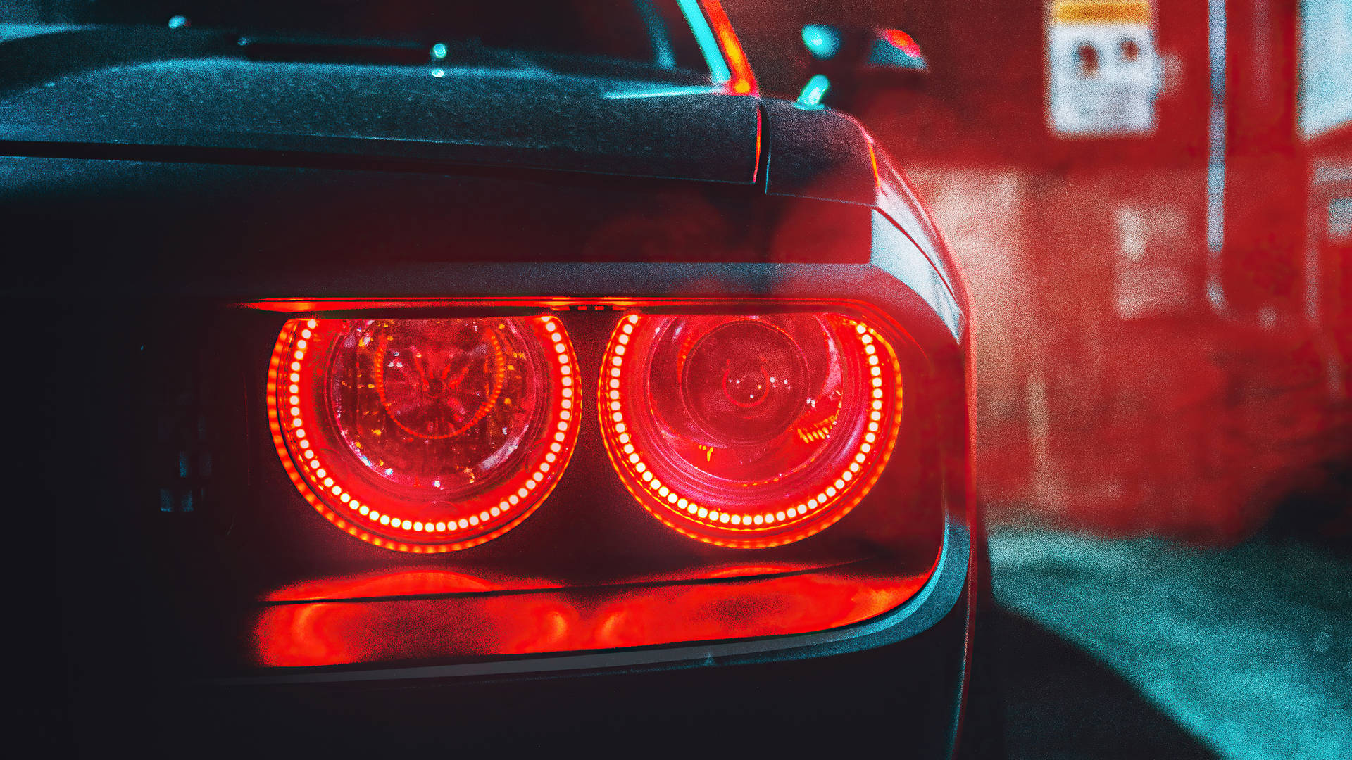 Download Power and Elegance Dodge Challenger Demon 4K with striking red tail lights. Wallpaper