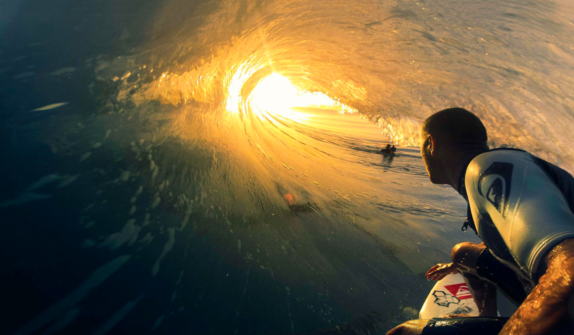 Surfing big wave sunset
