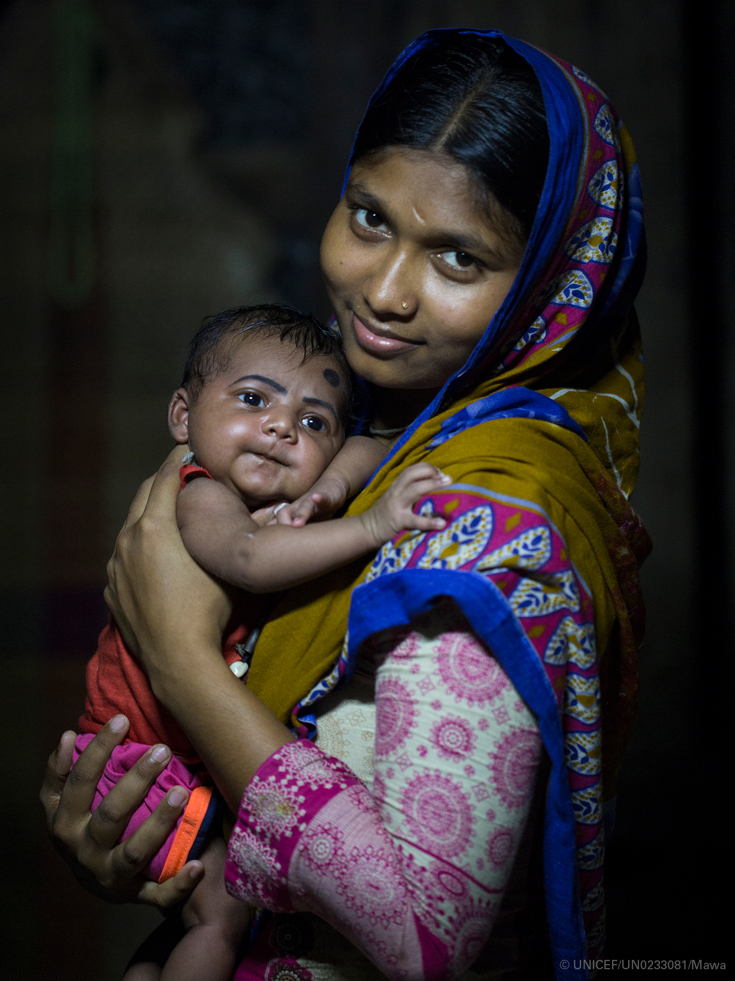 UNICEF mother cuddles her