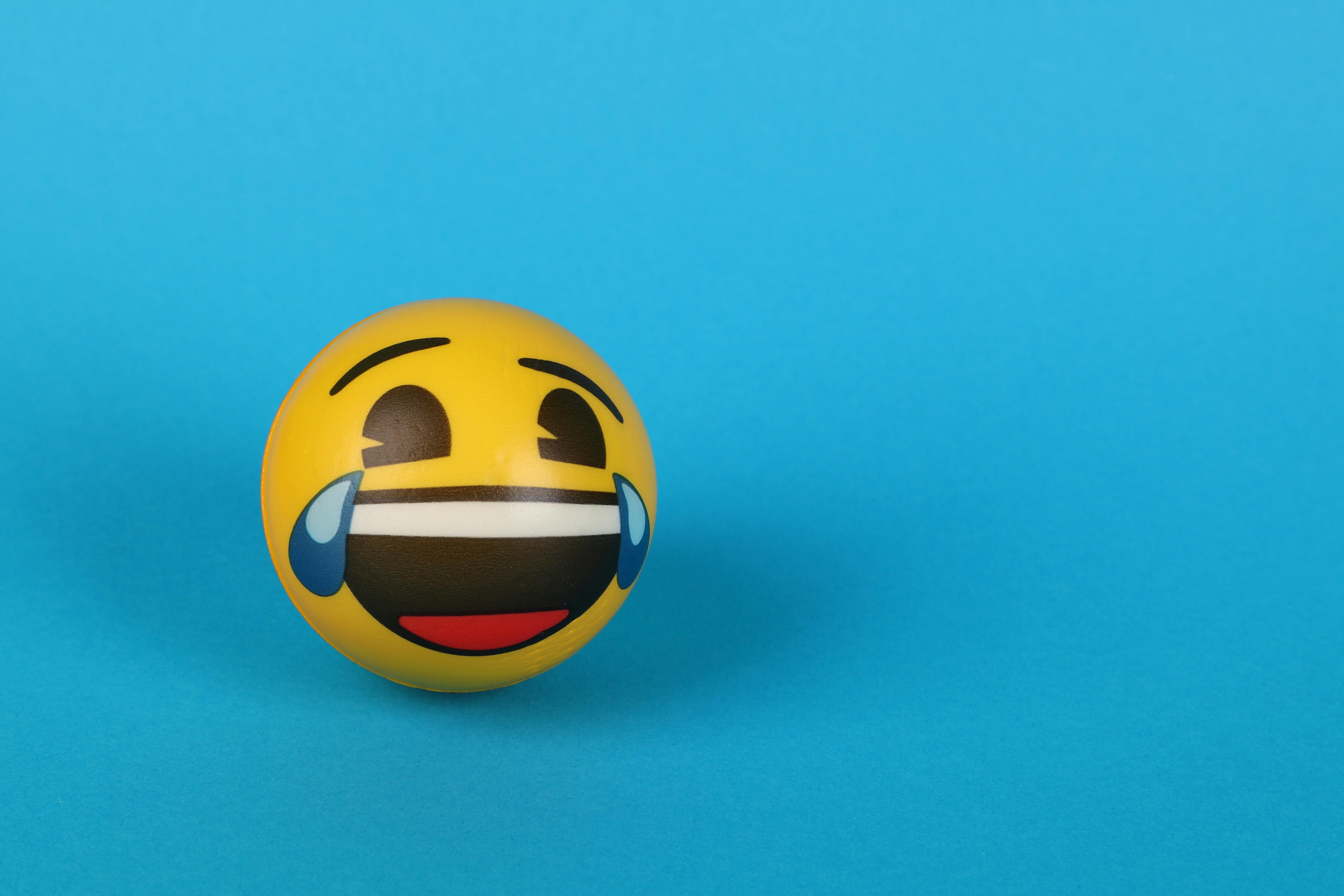 A Laughing Emoji with tears over Blue