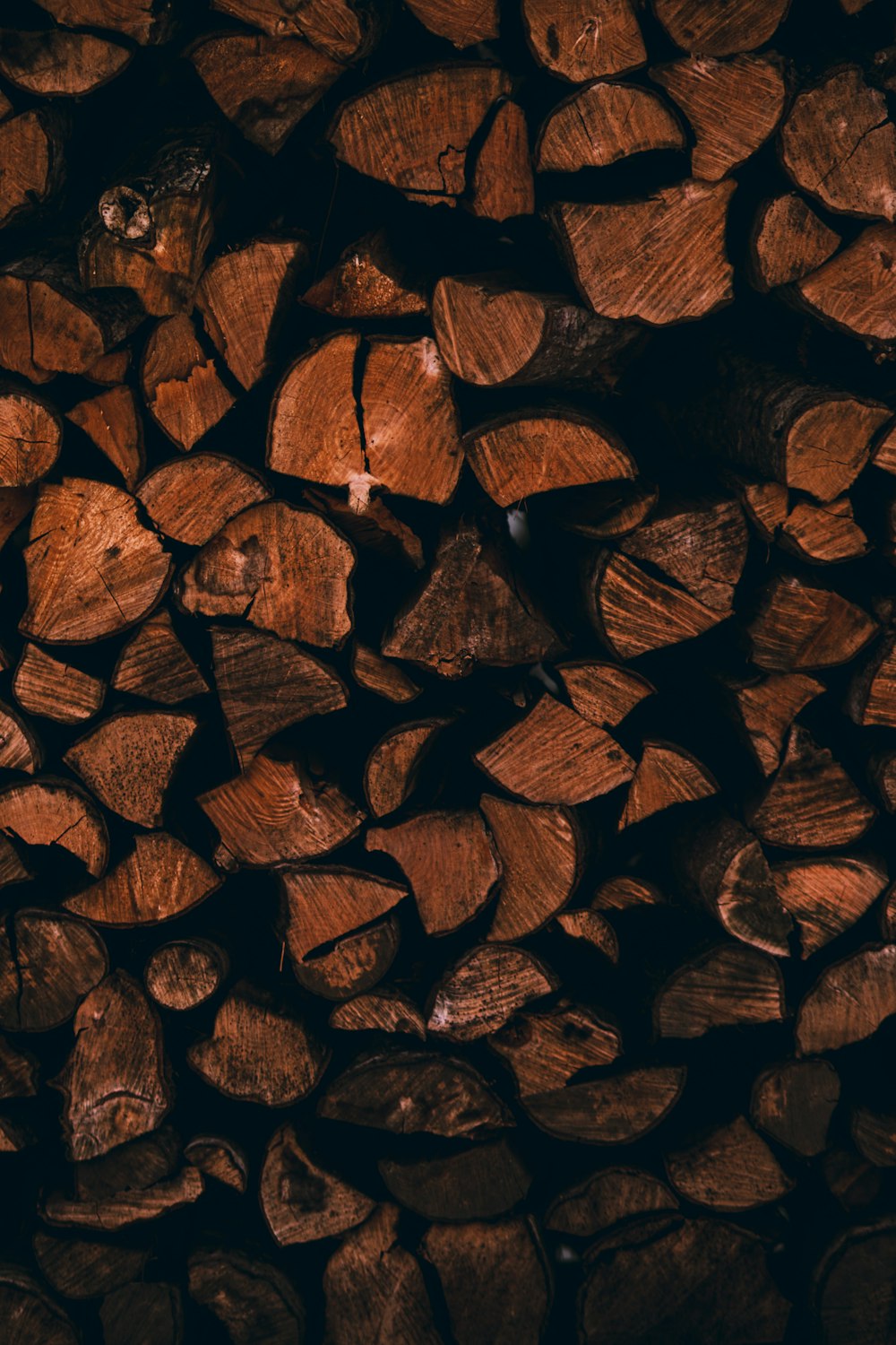 A pile of wood that is brown in color