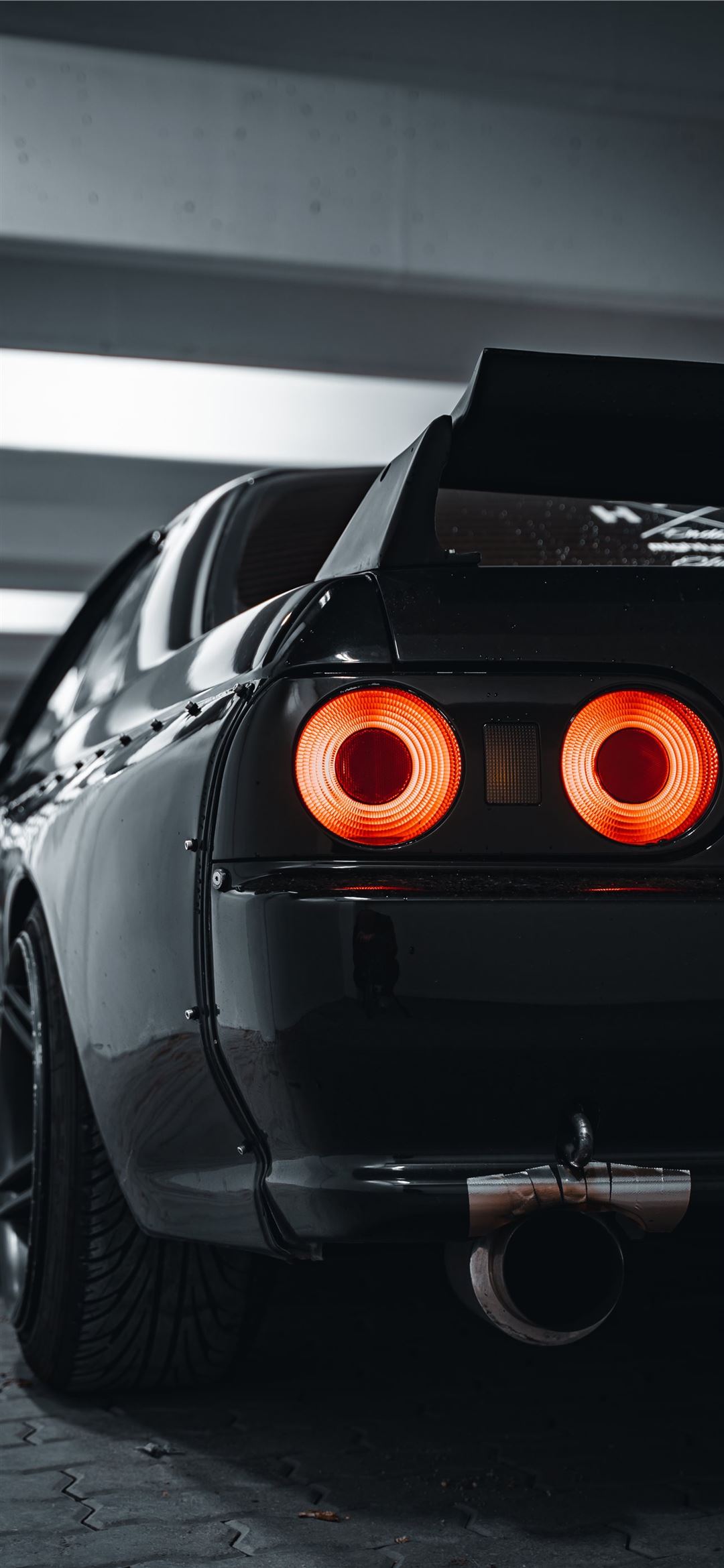 car in a parking lot iPhone Wallpaper