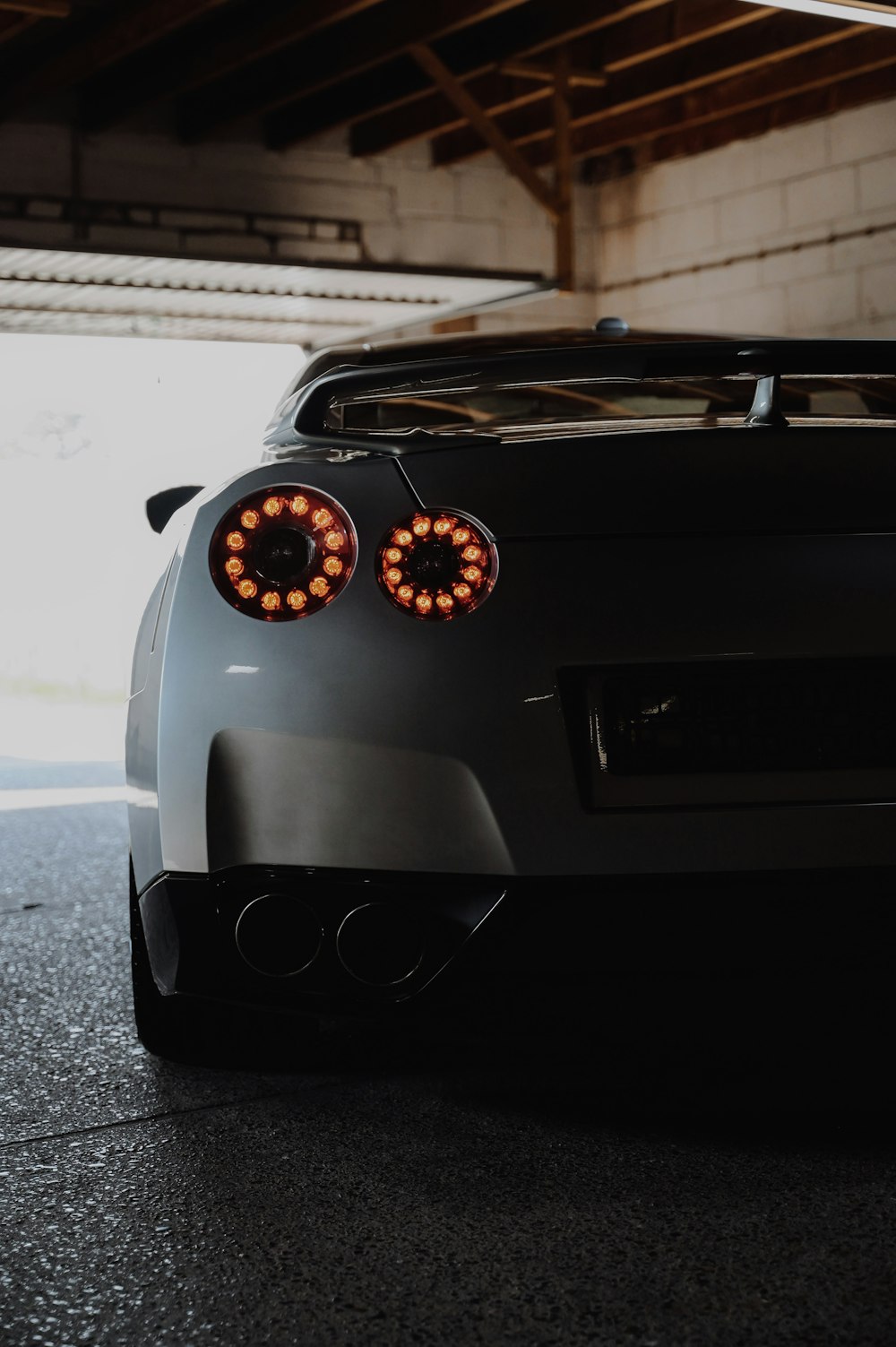 A black car with a light on the hood