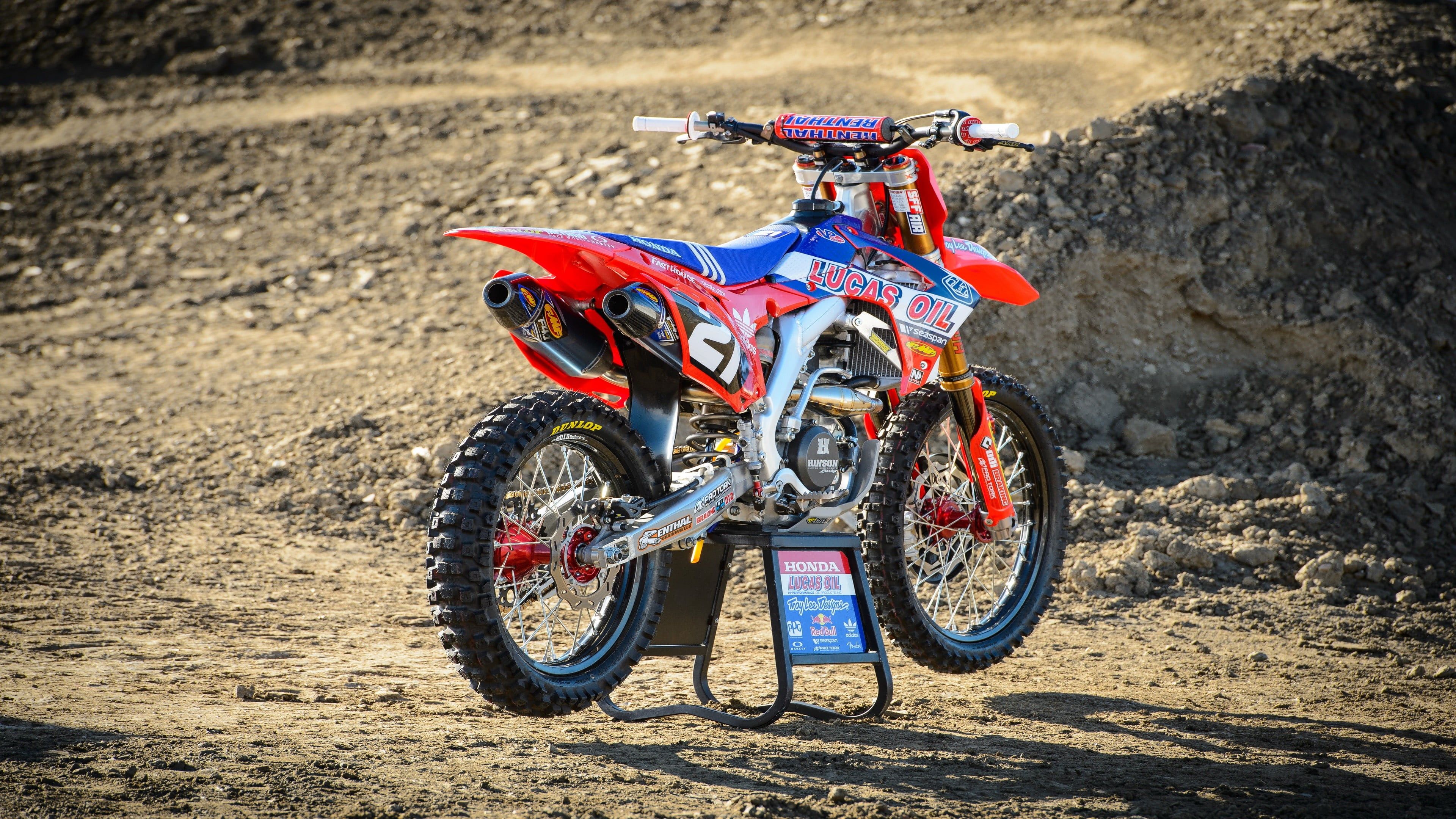 red and blue motocross dirt bike #Honda