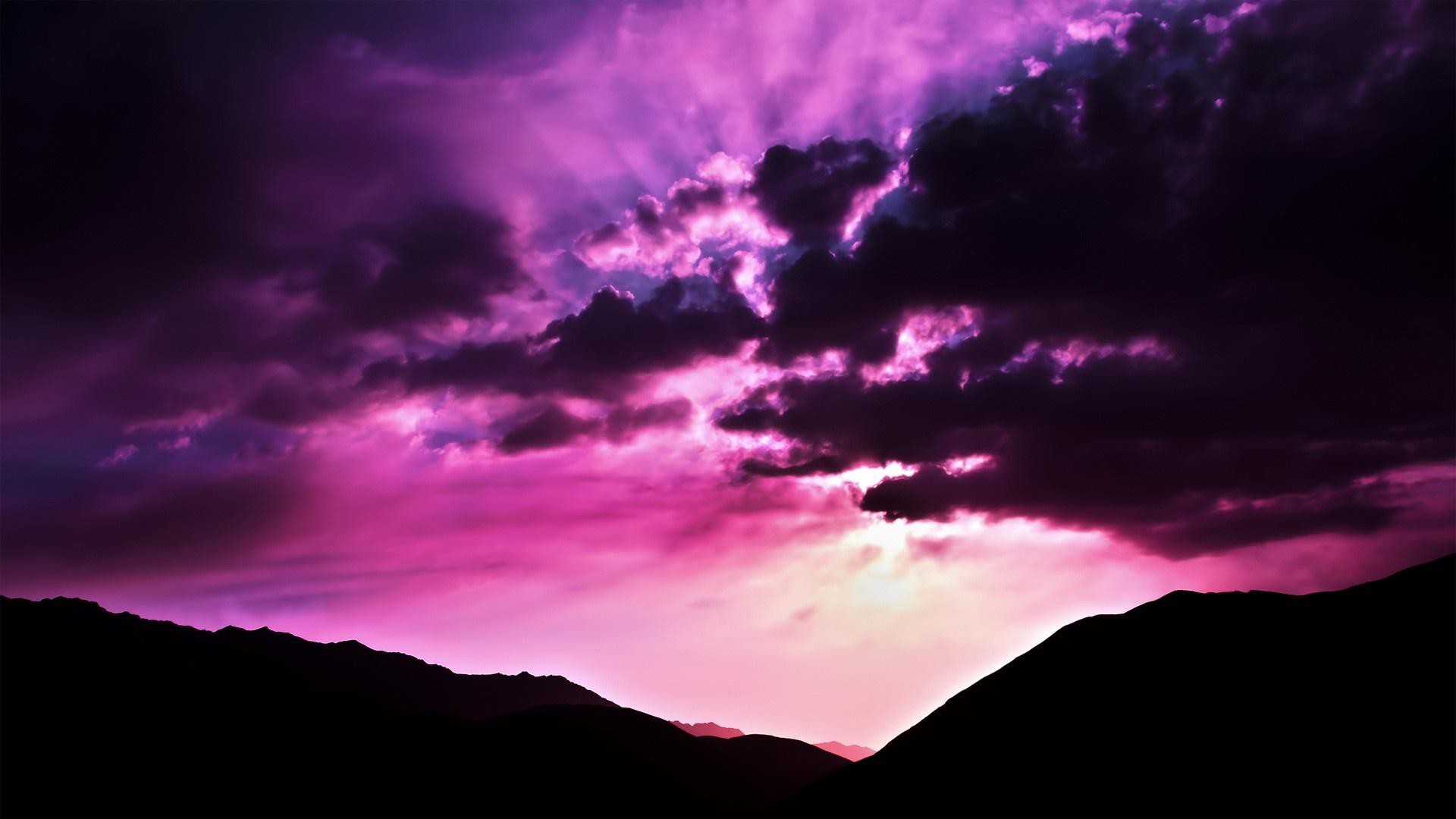 Cloudy Purple Sunset over the Mountains