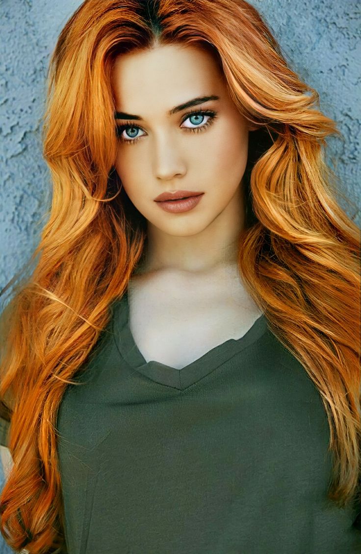Redhead in Green. Red haired beauty