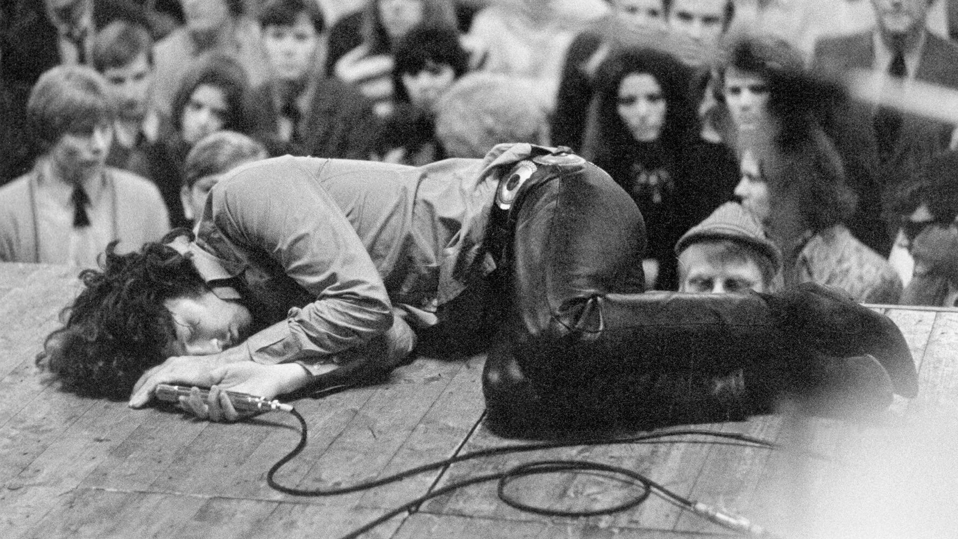 Jim Morrison Asleep on Stage Wallpaper