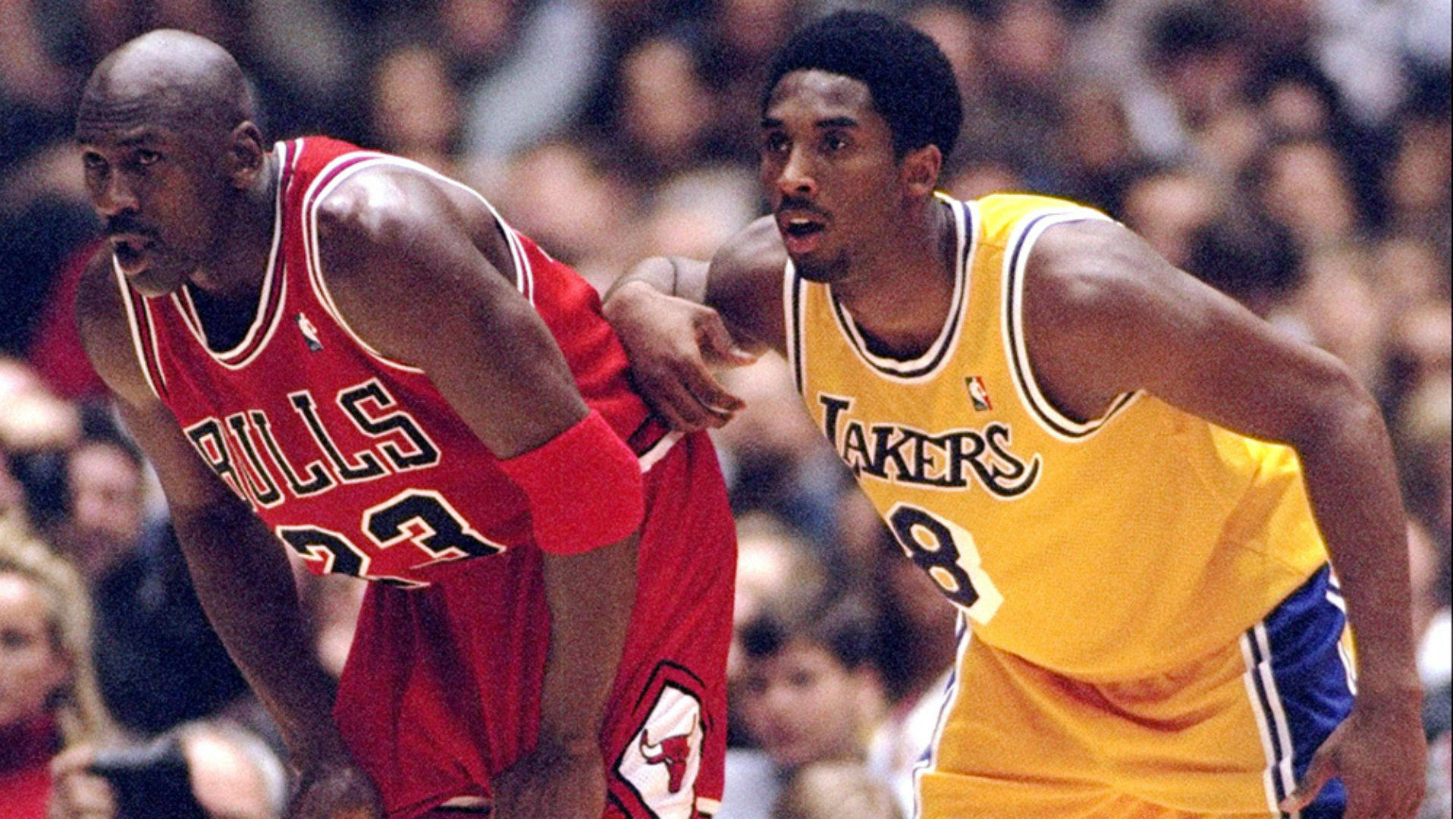 Download Kobe Bryant competing with Michael Jordan Wallpaper