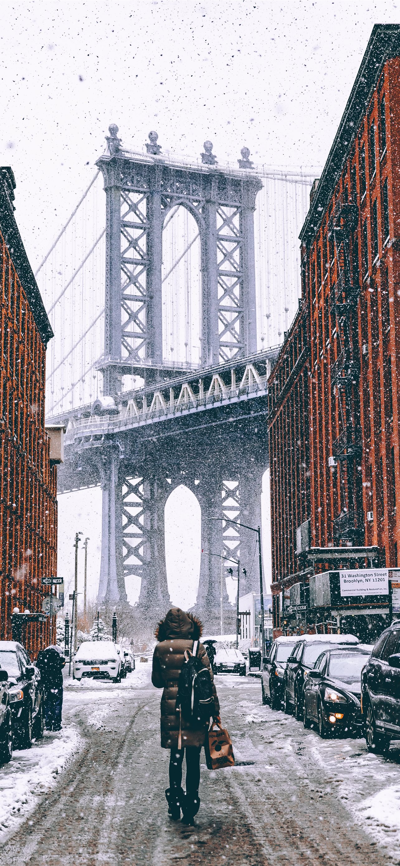 woman facing towards Brooklyn Bridge