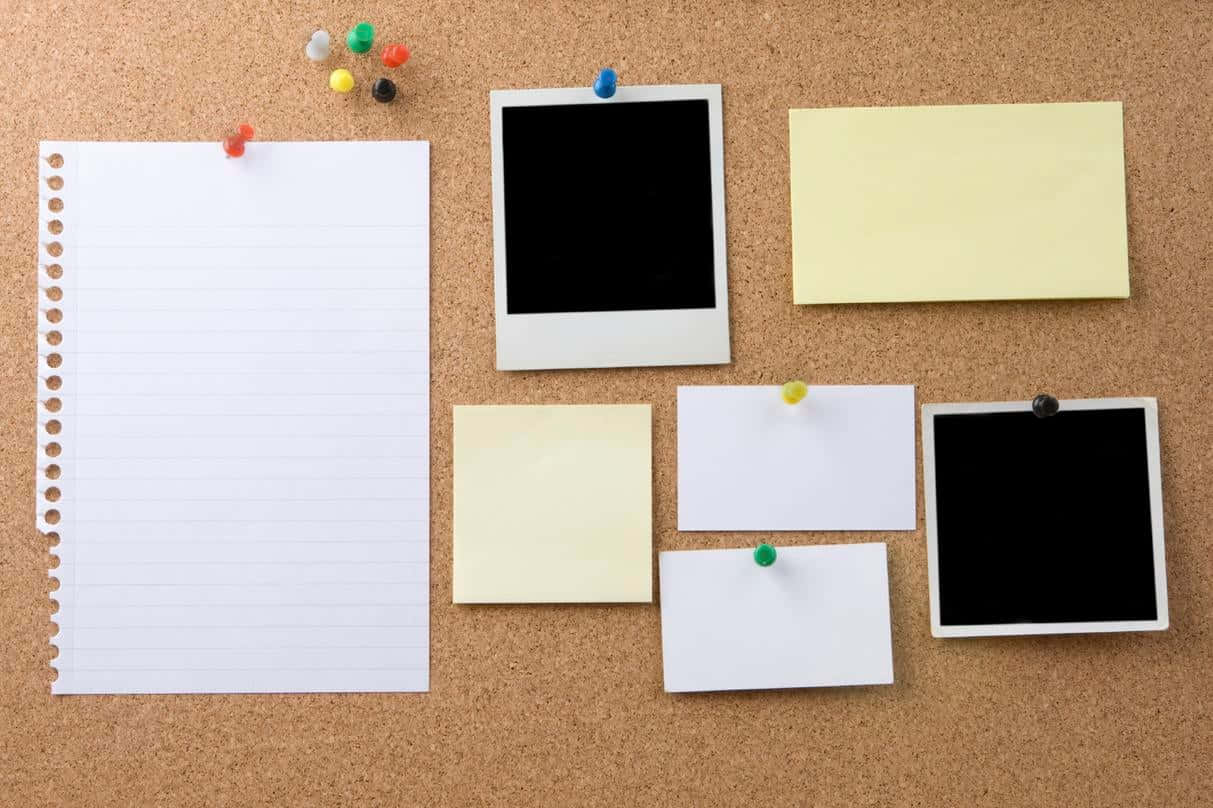 Cork Board With Various Paper And Pins