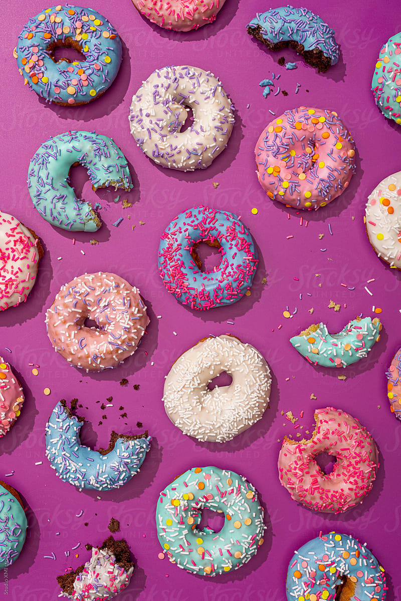 Messy Donuts On A Purple Background