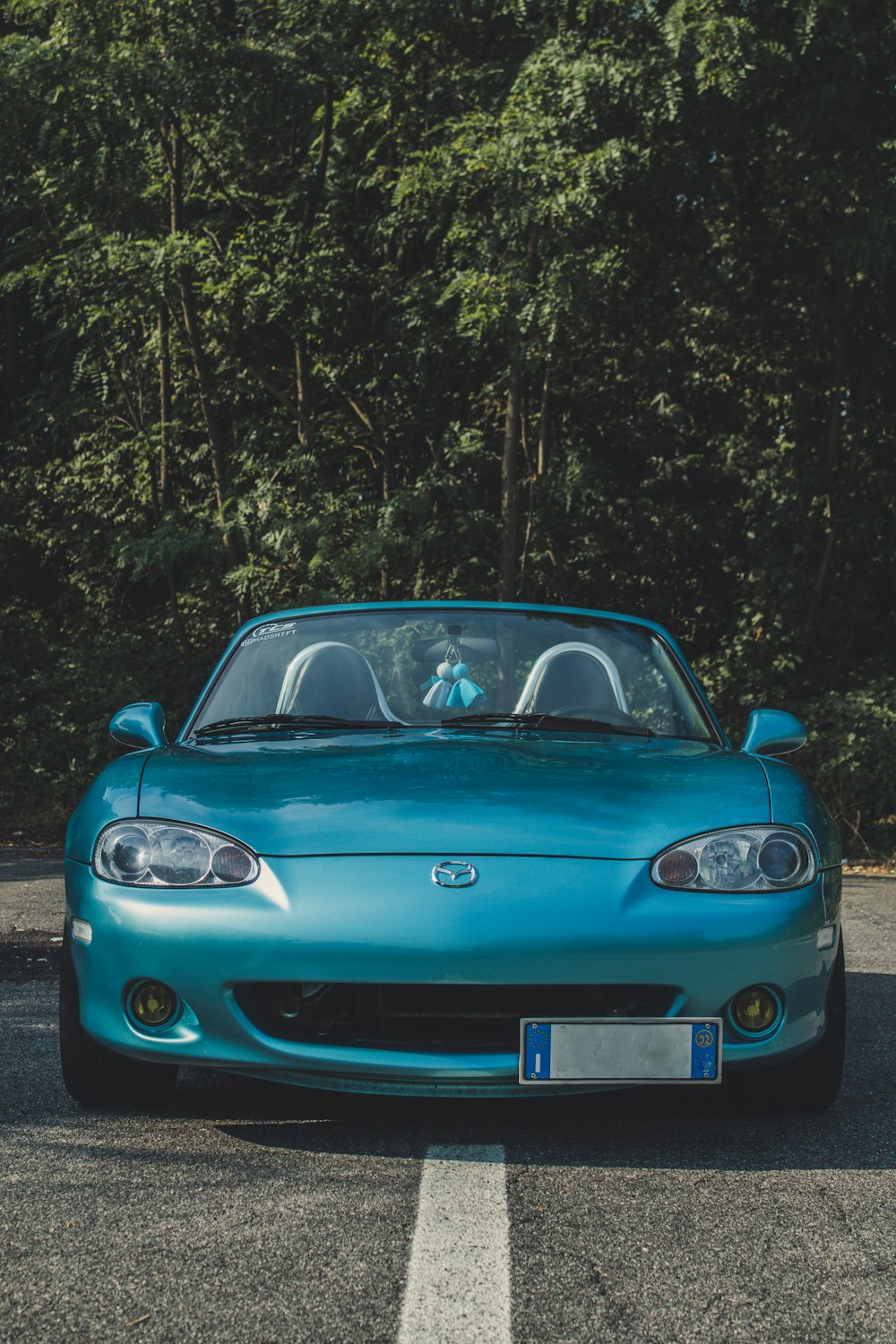 Blue Mazda Miata convertible coupe