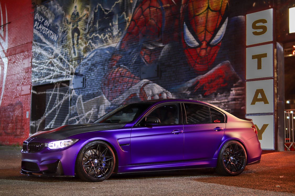 Parked Purple BMW M3 Car in front of a