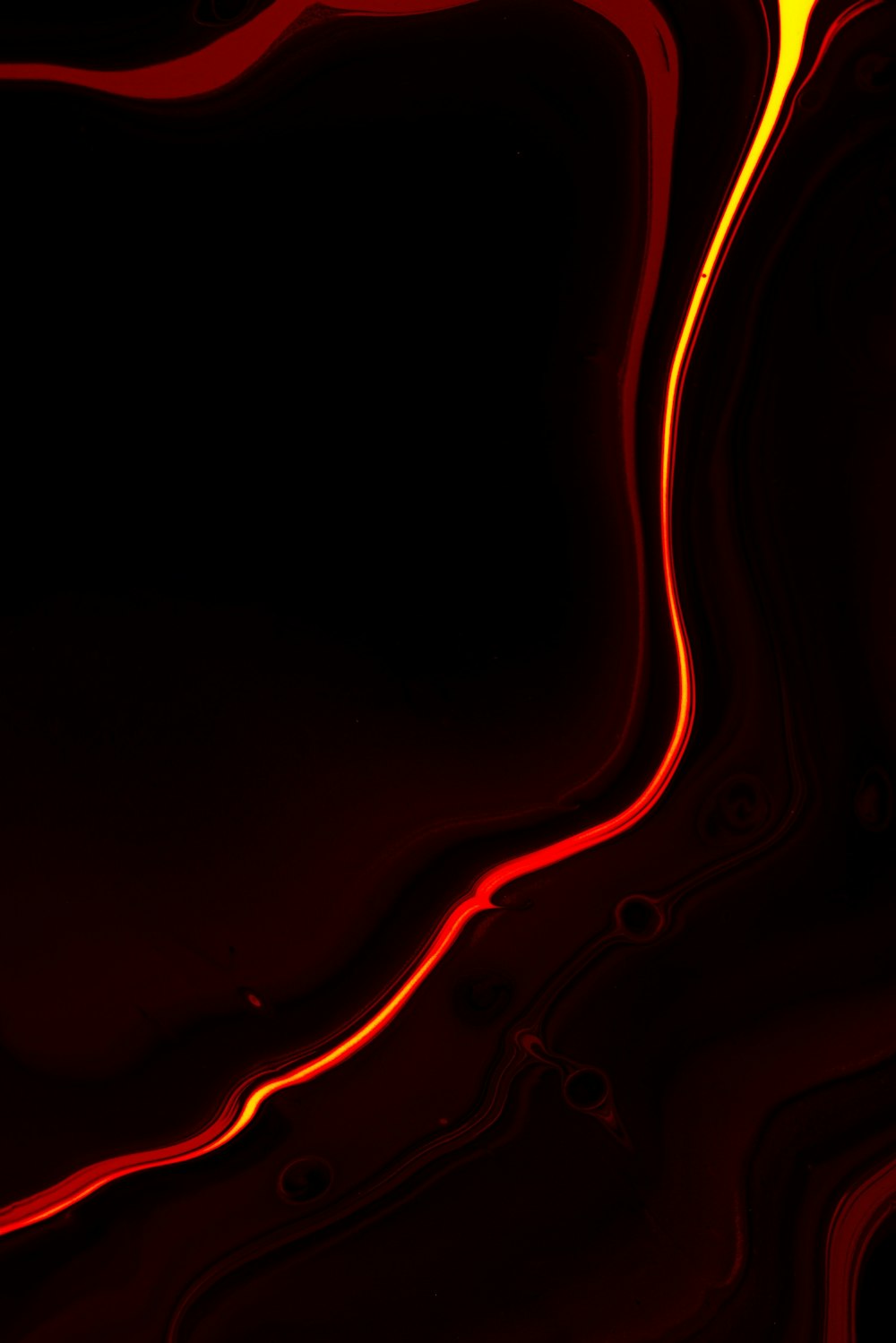 A black background with red and yellow