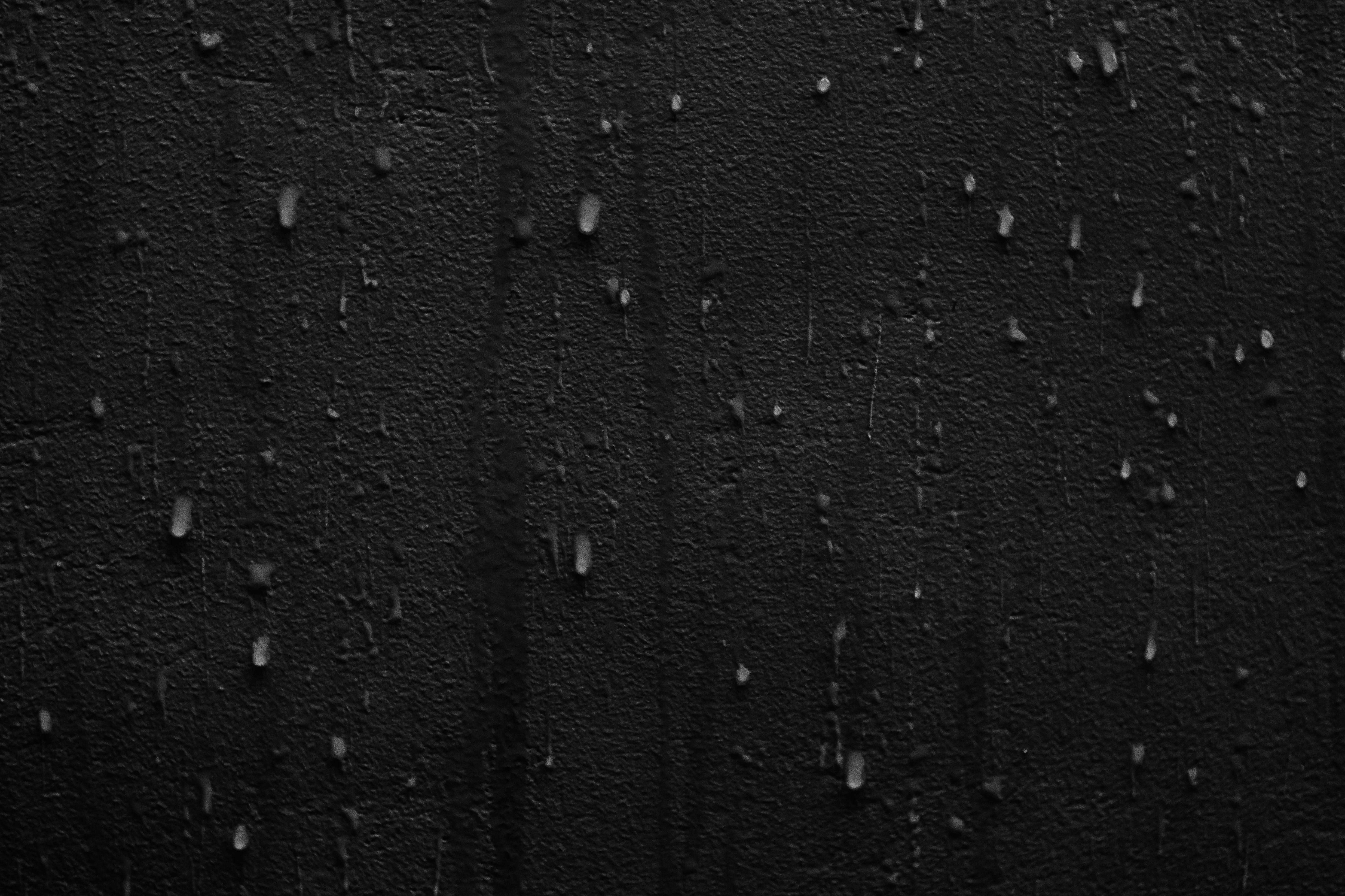 Rain Drops on a Black Wall · Free Stock