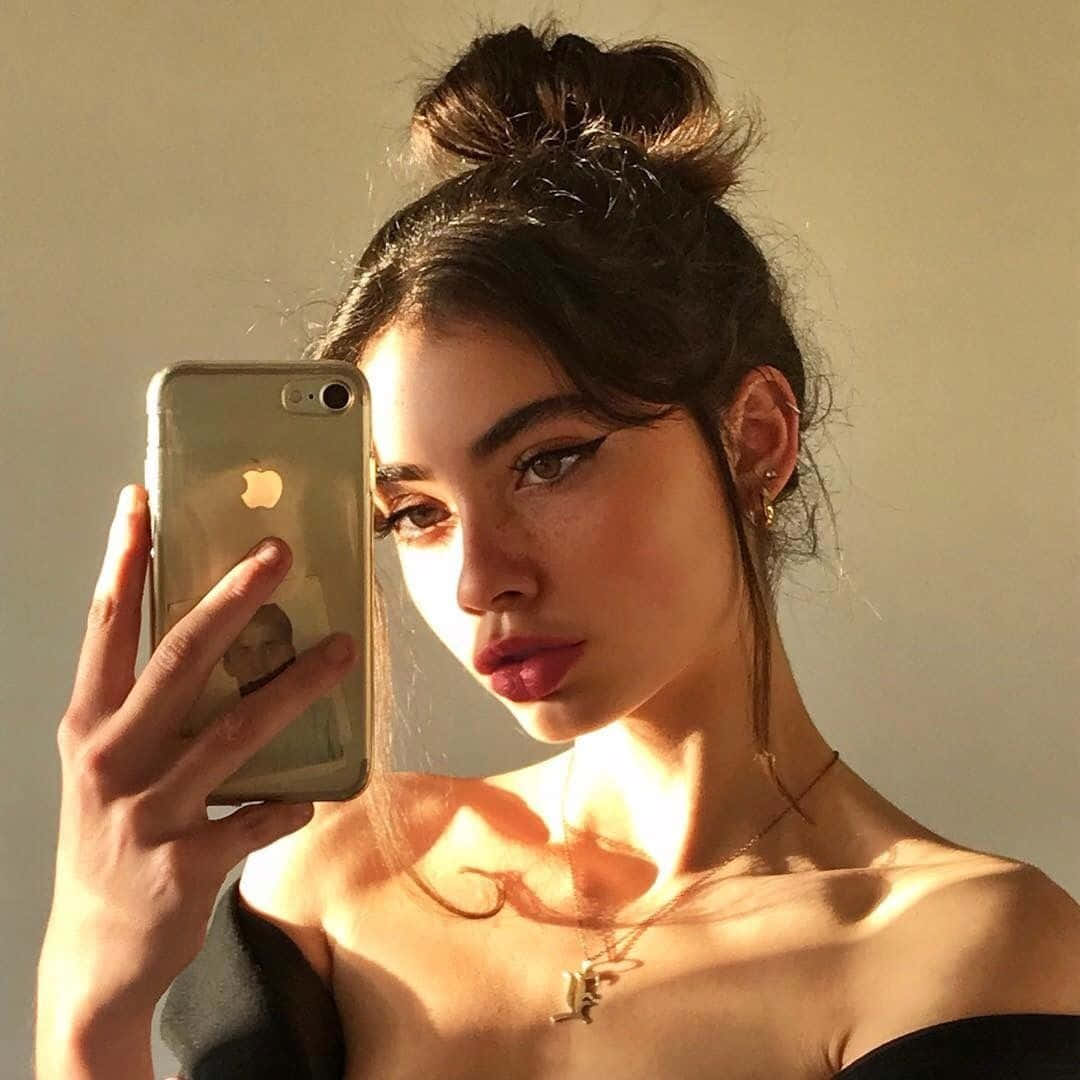 Woman Taking A Selfie With Her Phone