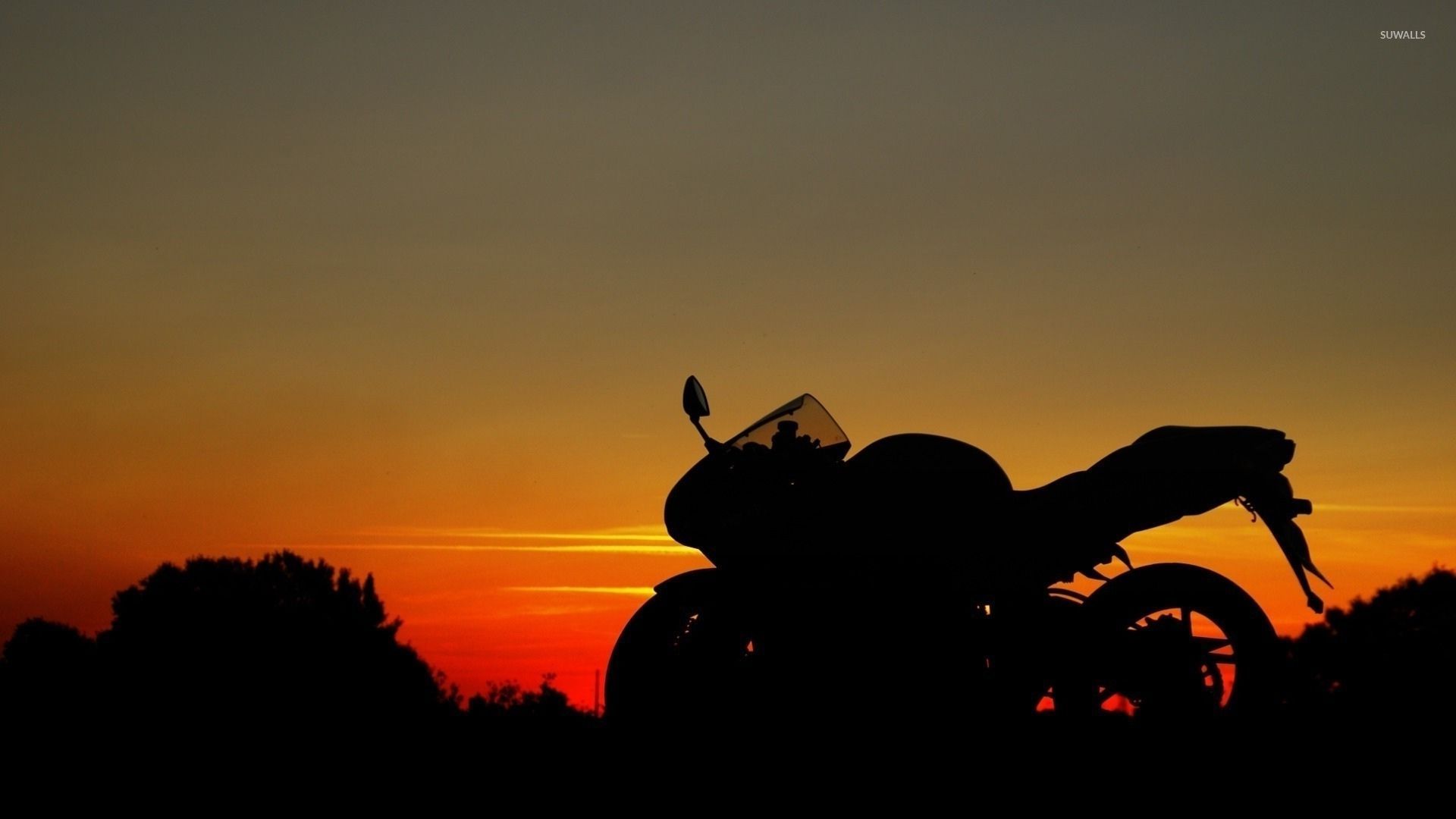Motorcycle silhouette at sunset