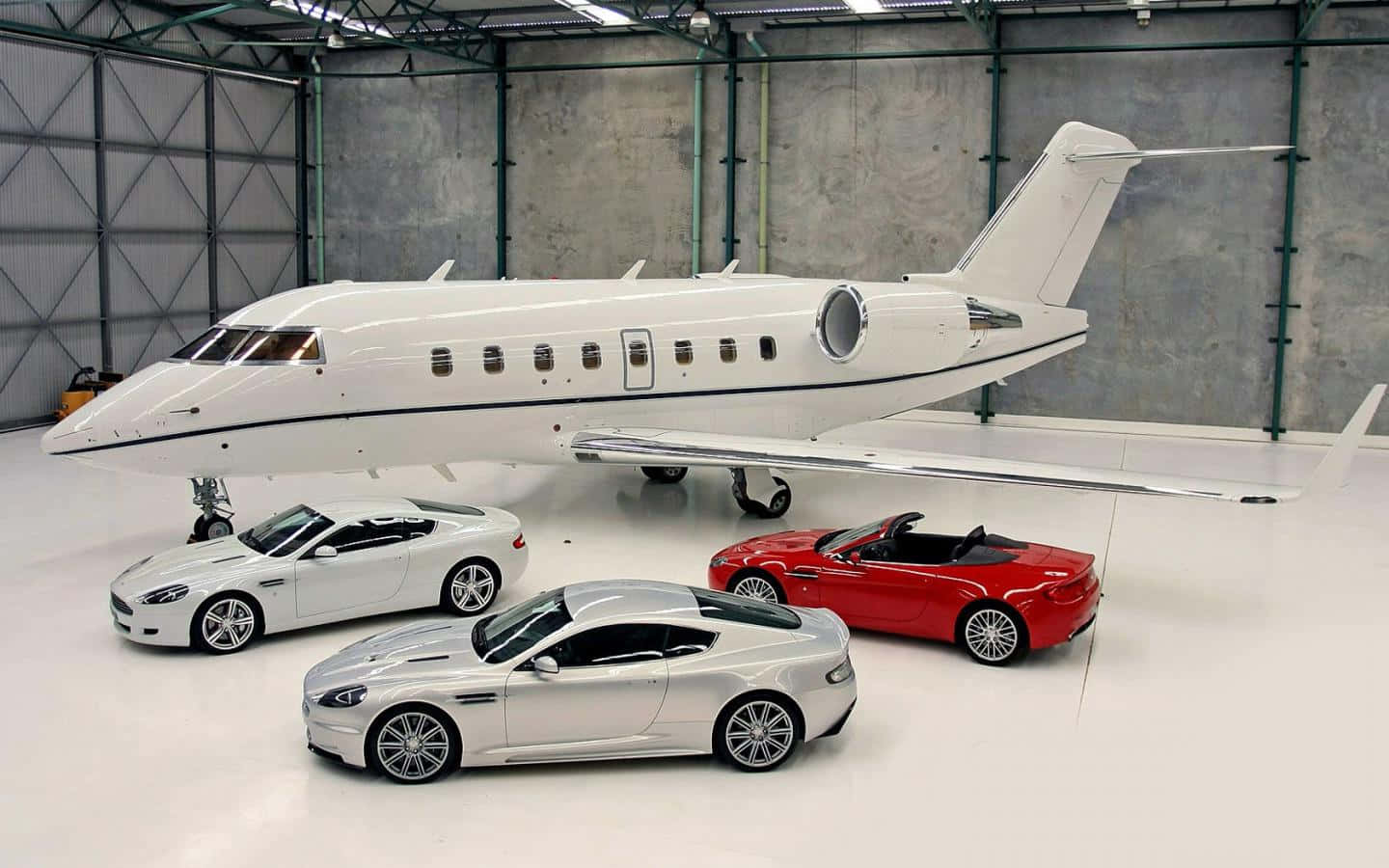 Download Private Jet With Luxury Cars Wallpaper