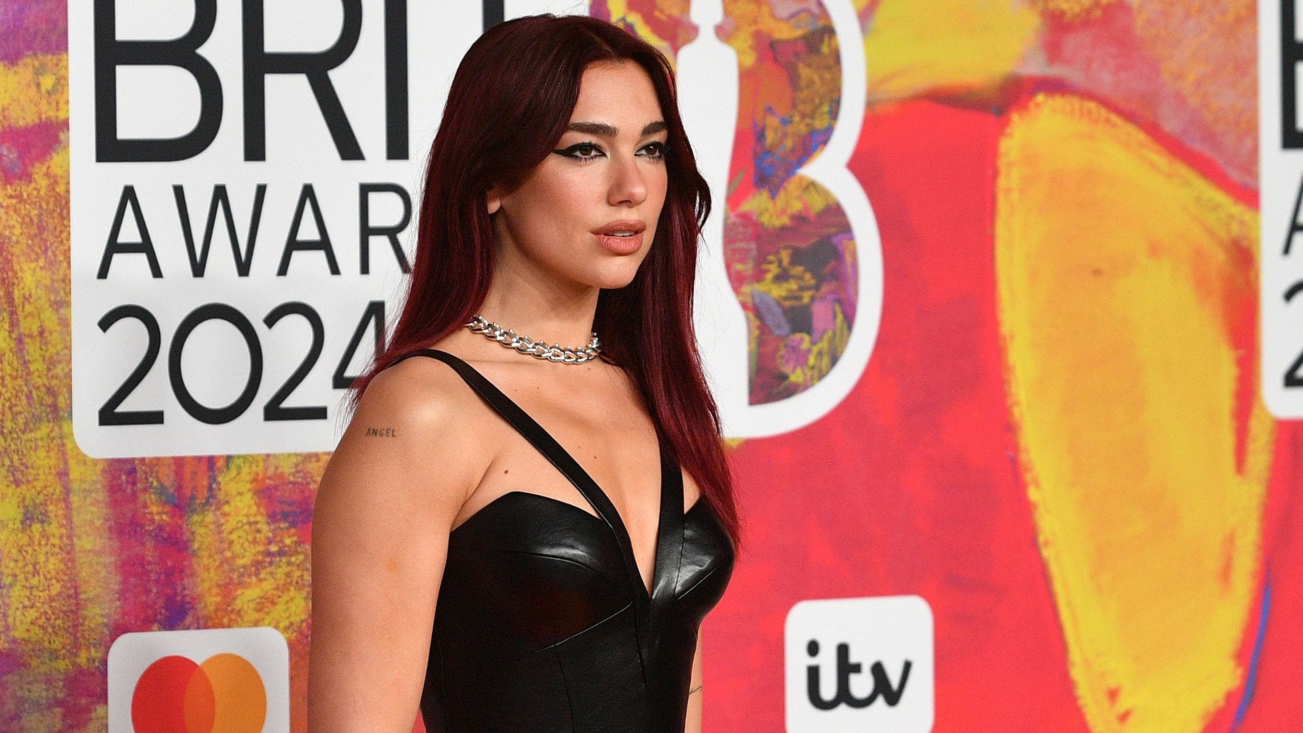 Dua Lipa Slips Into Leather Versace LBD