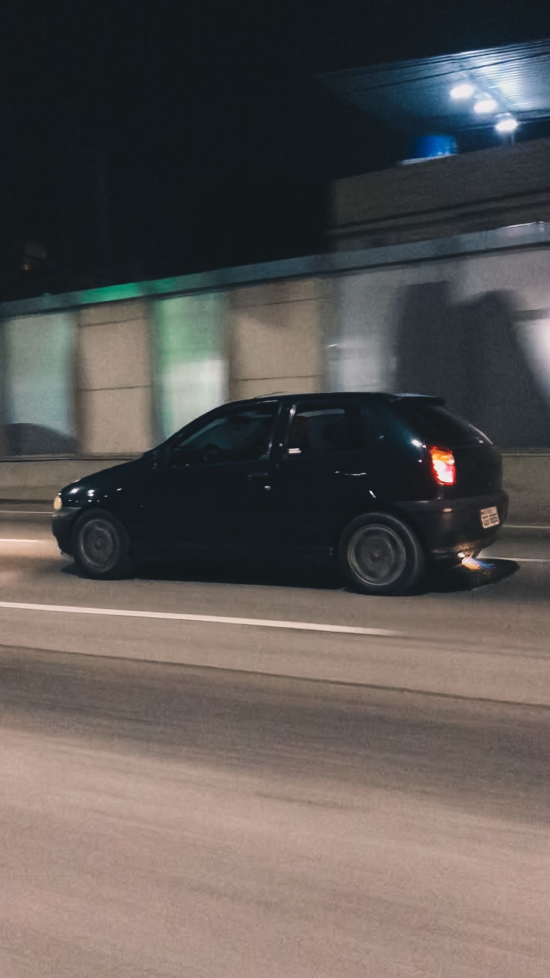 Black Fiat Palio Driving