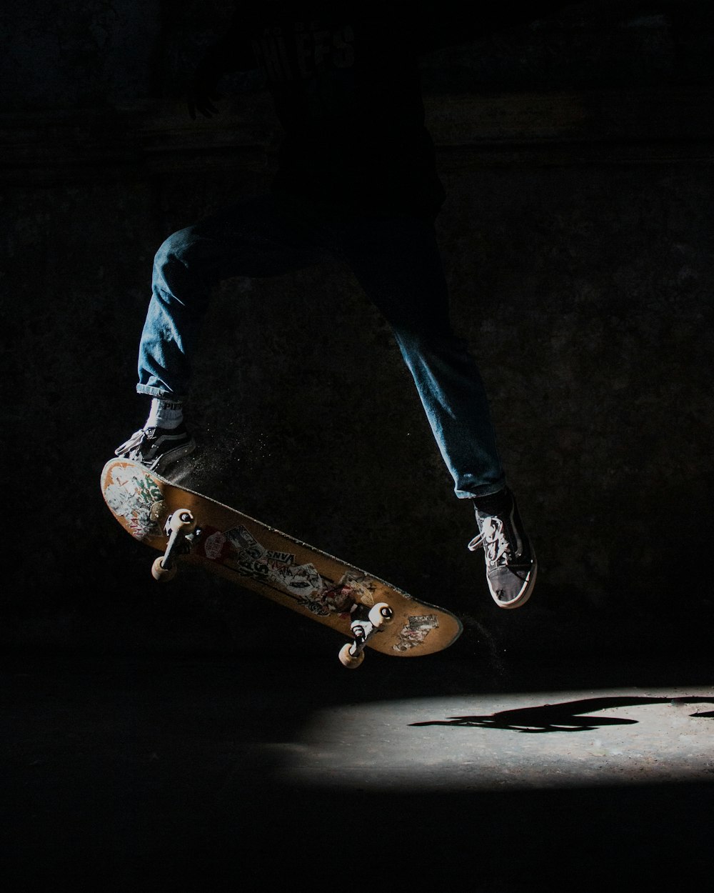 stunt using brown skateboard