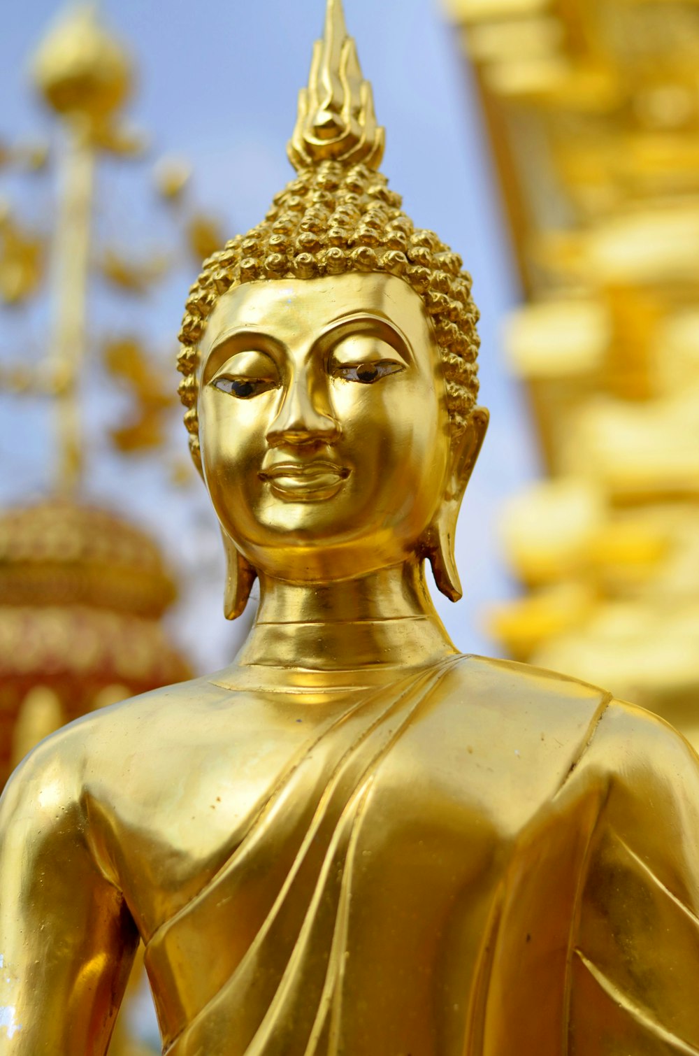 Gold buddha statue during daytime photo