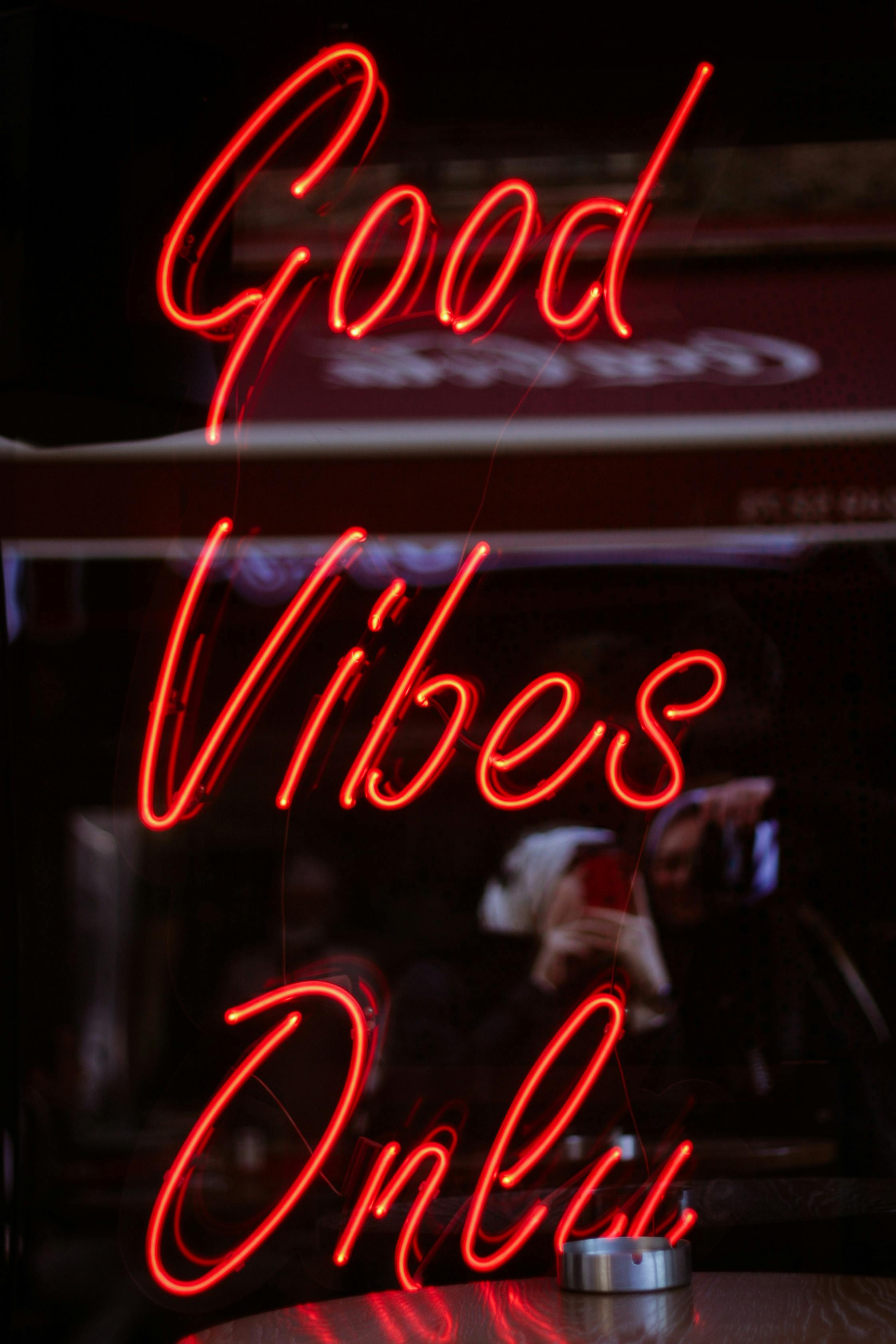 Neon Sign Good Vibes Only in a Window · Free