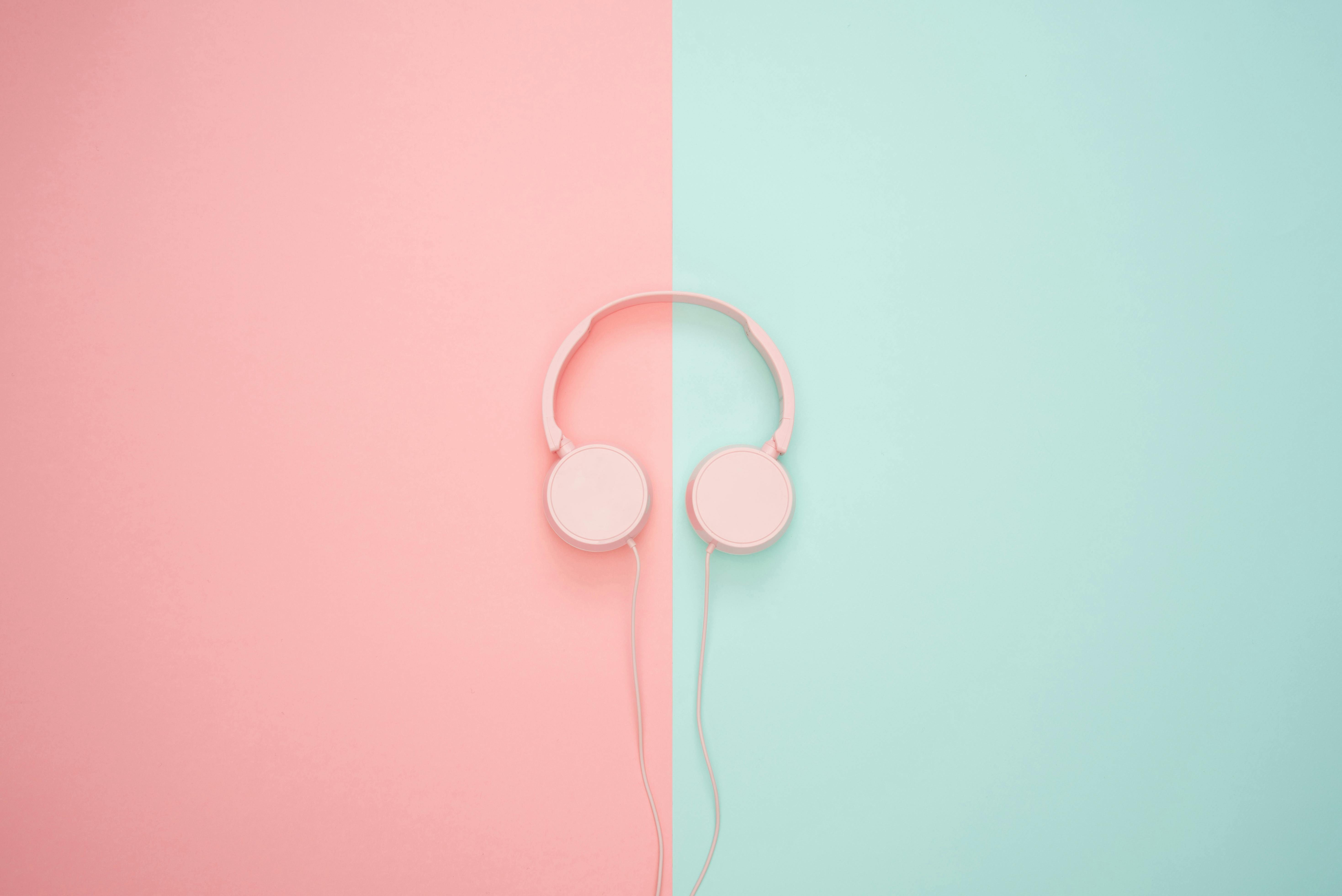Pink Corded Headphones on pink and teal