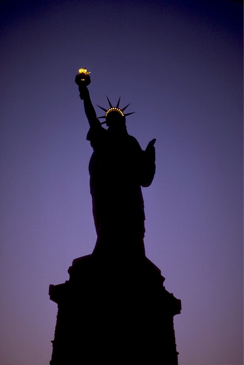 Liberty statue blue sky background